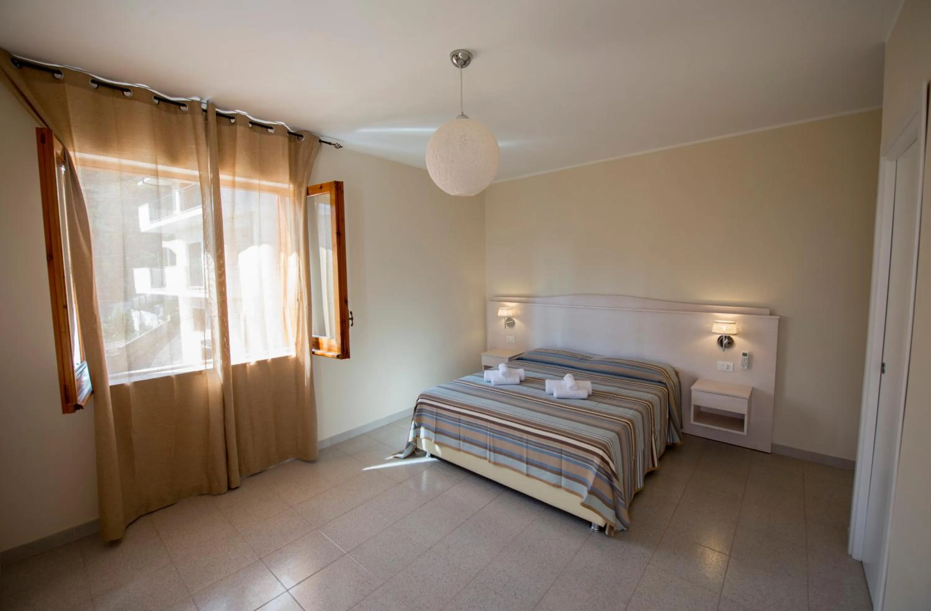 Photo of the whole room, Bed in Donna Rosa Accommodation