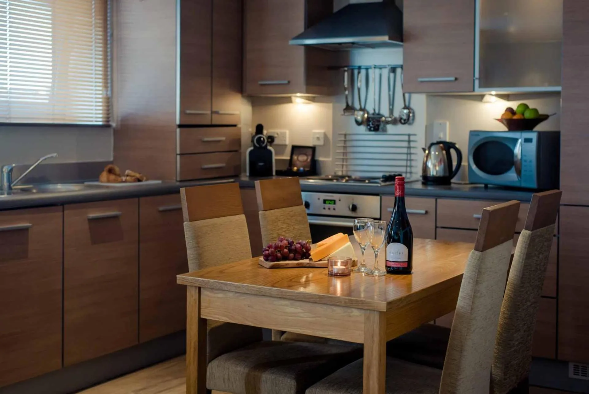 Kitchen or kitchenette in PREMIER SUITES Newcastle