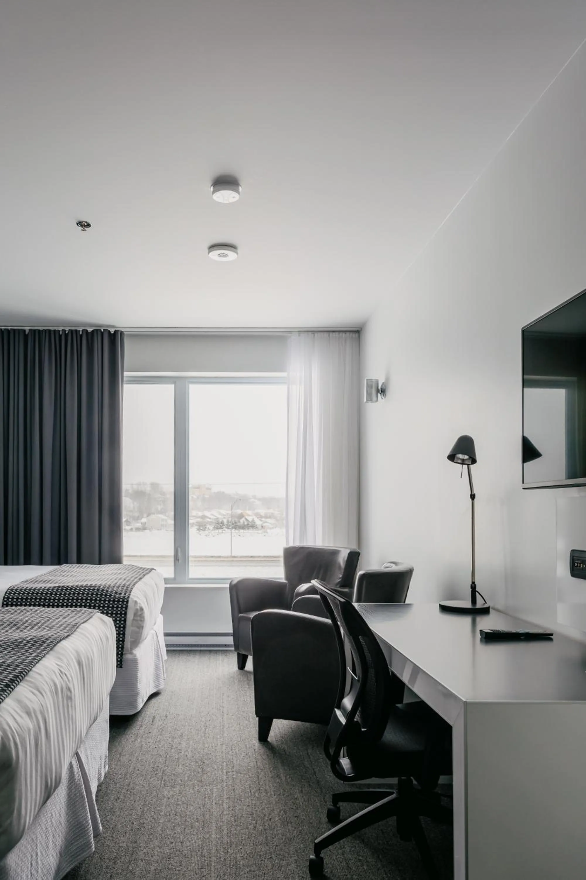 Photo of the whole room, Bed in Riotel Matane