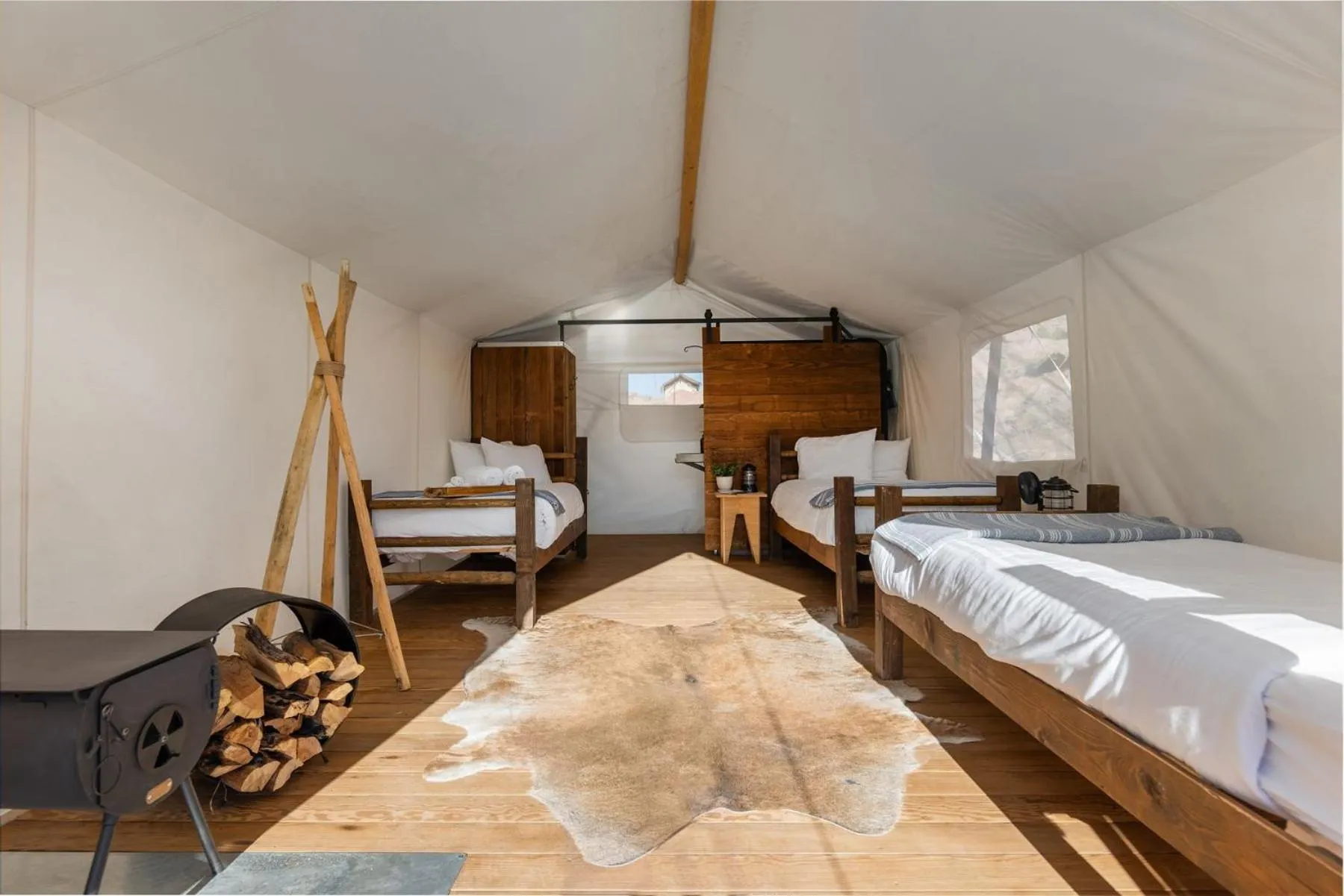 Photo of the whole room, Bed in Under Canvas Zion