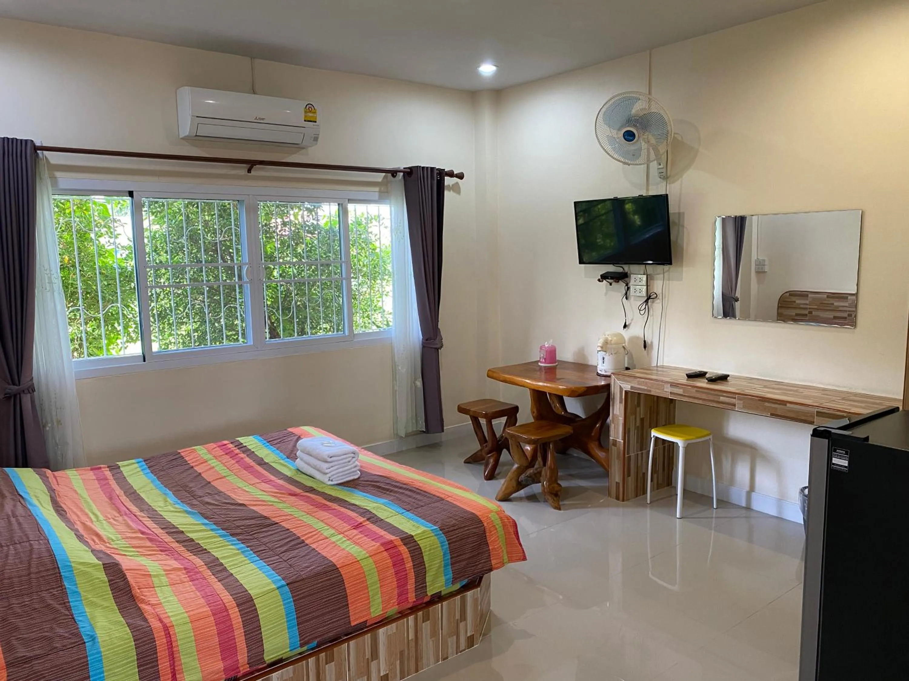 Bed in Baan Suan Palm Resort