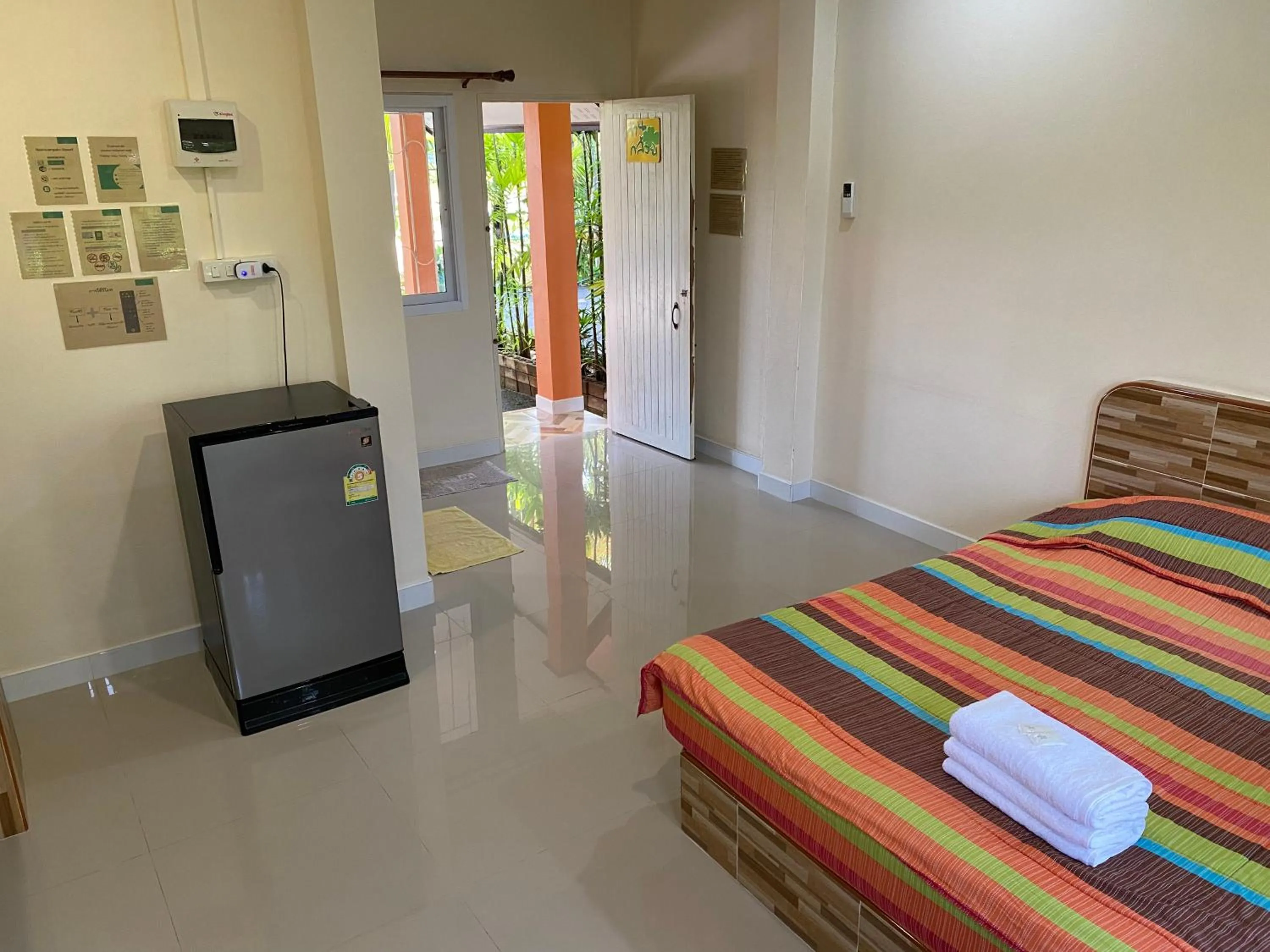 Bed in Baan Suan Palm Resort