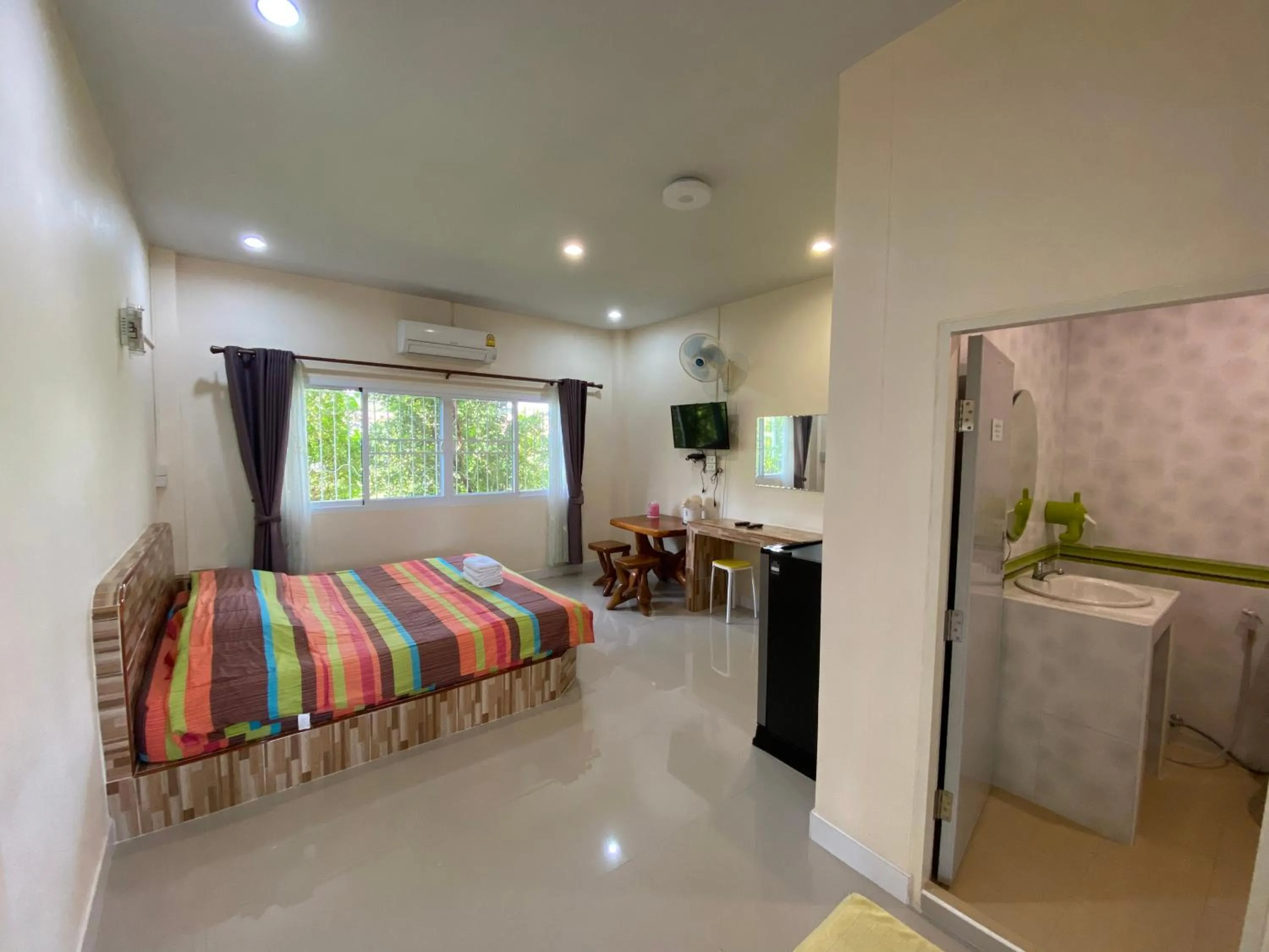 Bed in Baan Suan Palm Resort