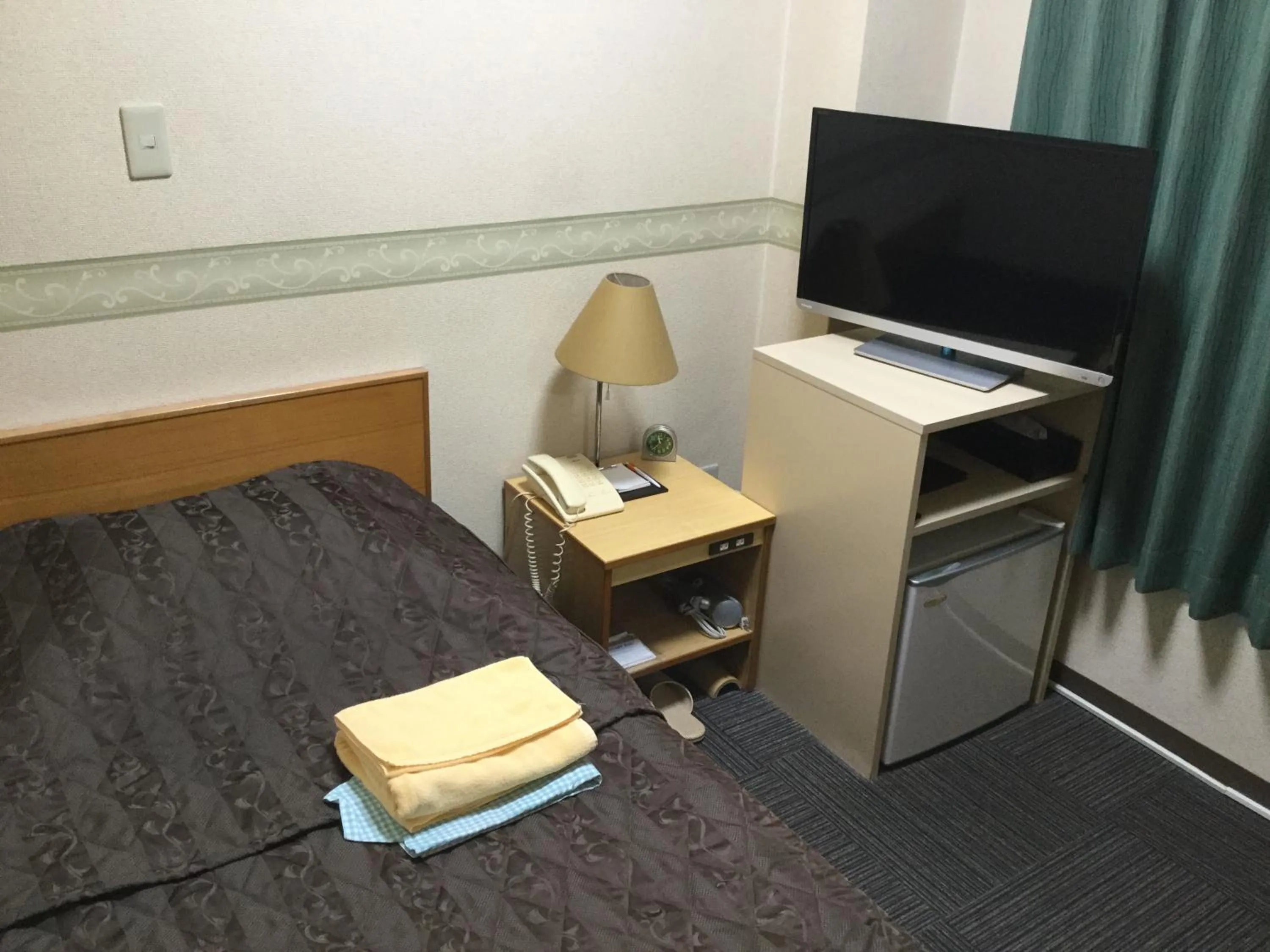 Bed in Maebashi Business Hotel Luka