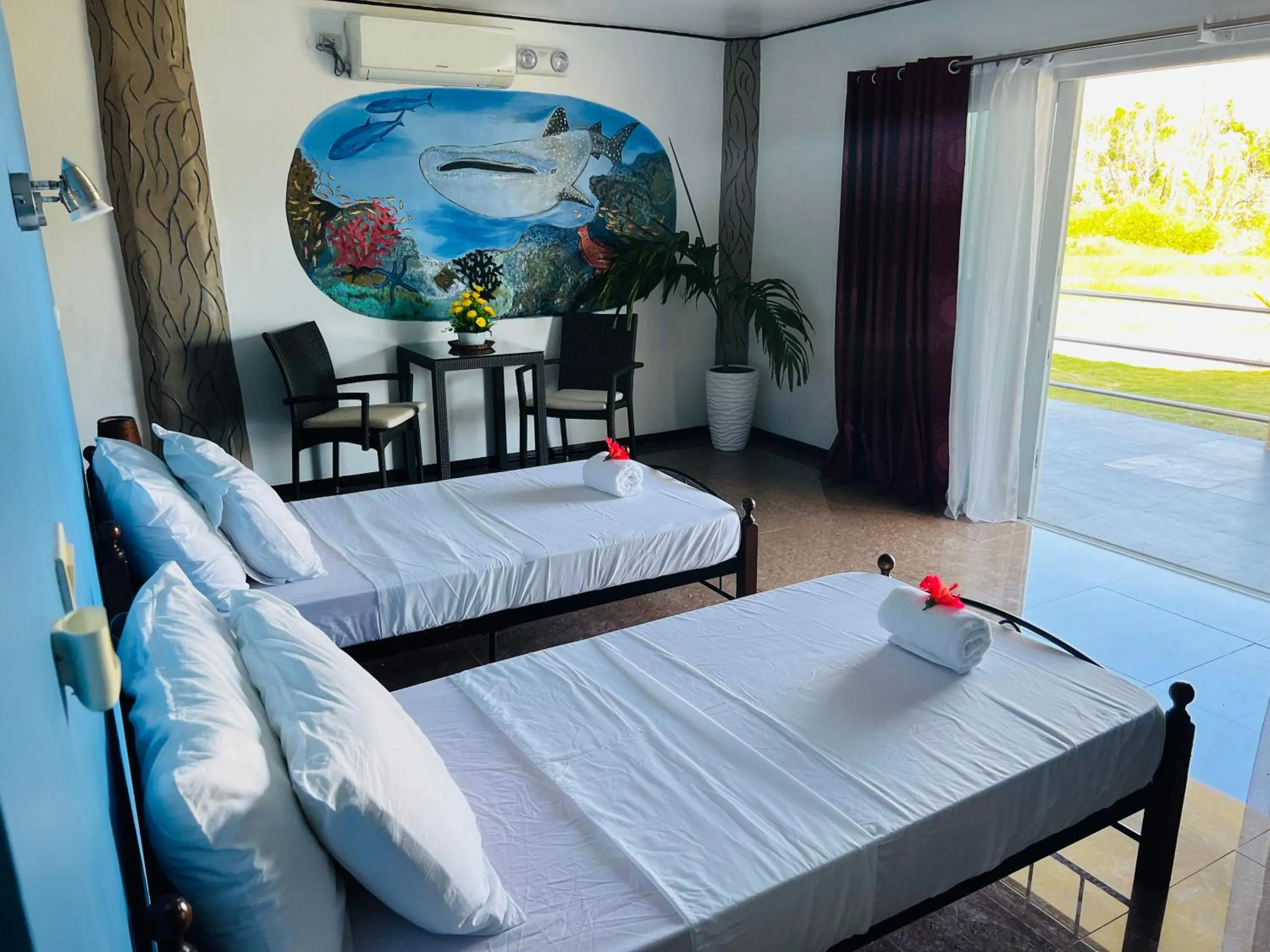 Bed in Cabilao Sunset Dive & Beach Resort