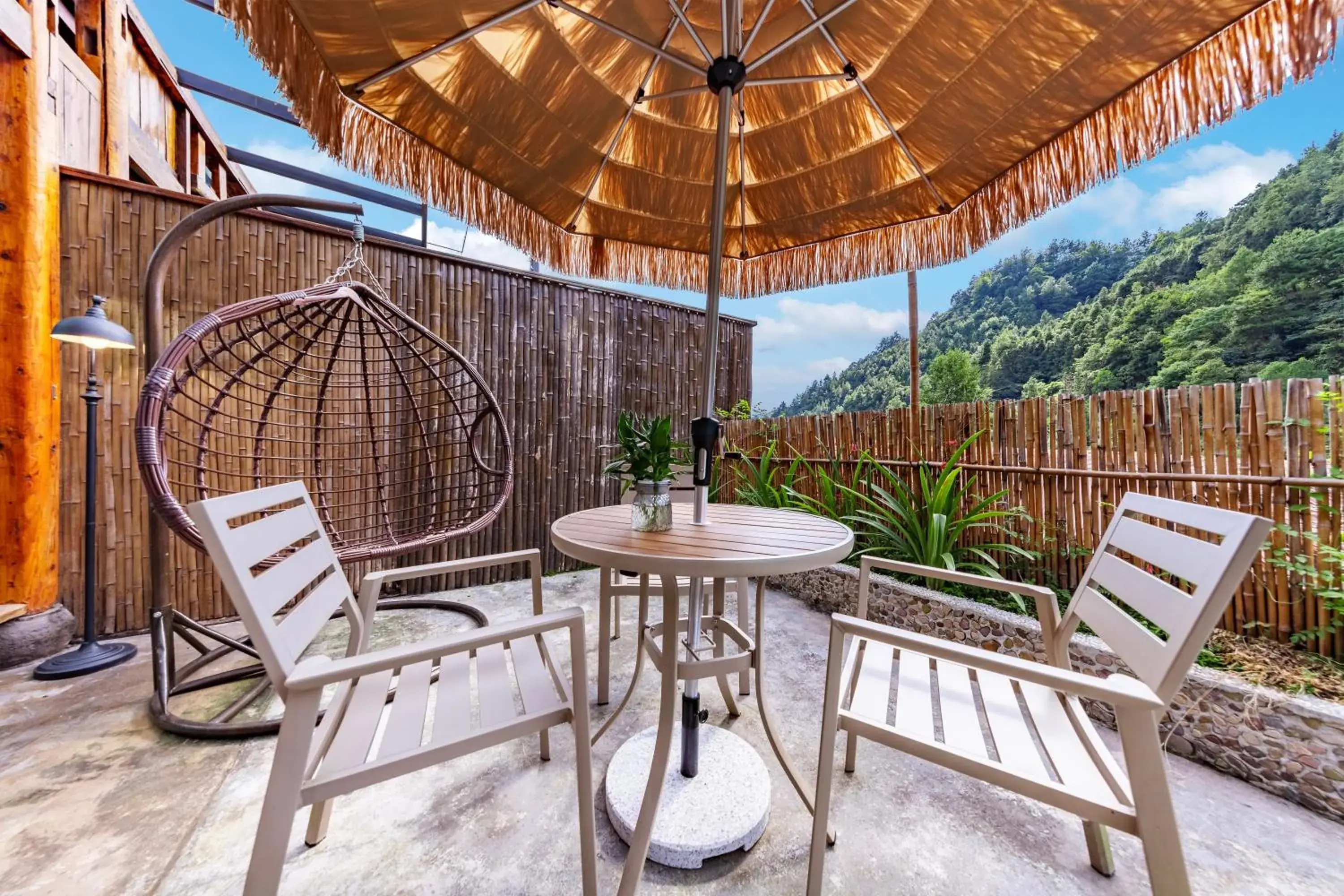 Courtyard Deluxe King Room with Small Courtyard, Grass Umbrella, Swing, and Fireplace in Homeward Mountain Resort Courtyard Deluxe King Room with Small Courtyard, Grass Umbrella, Swing, and Fireplace in Homeward Mountain Resort