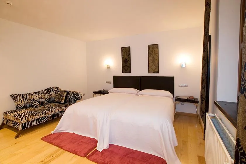 Bed in Hotel y apartamentos rurales L'Anceo