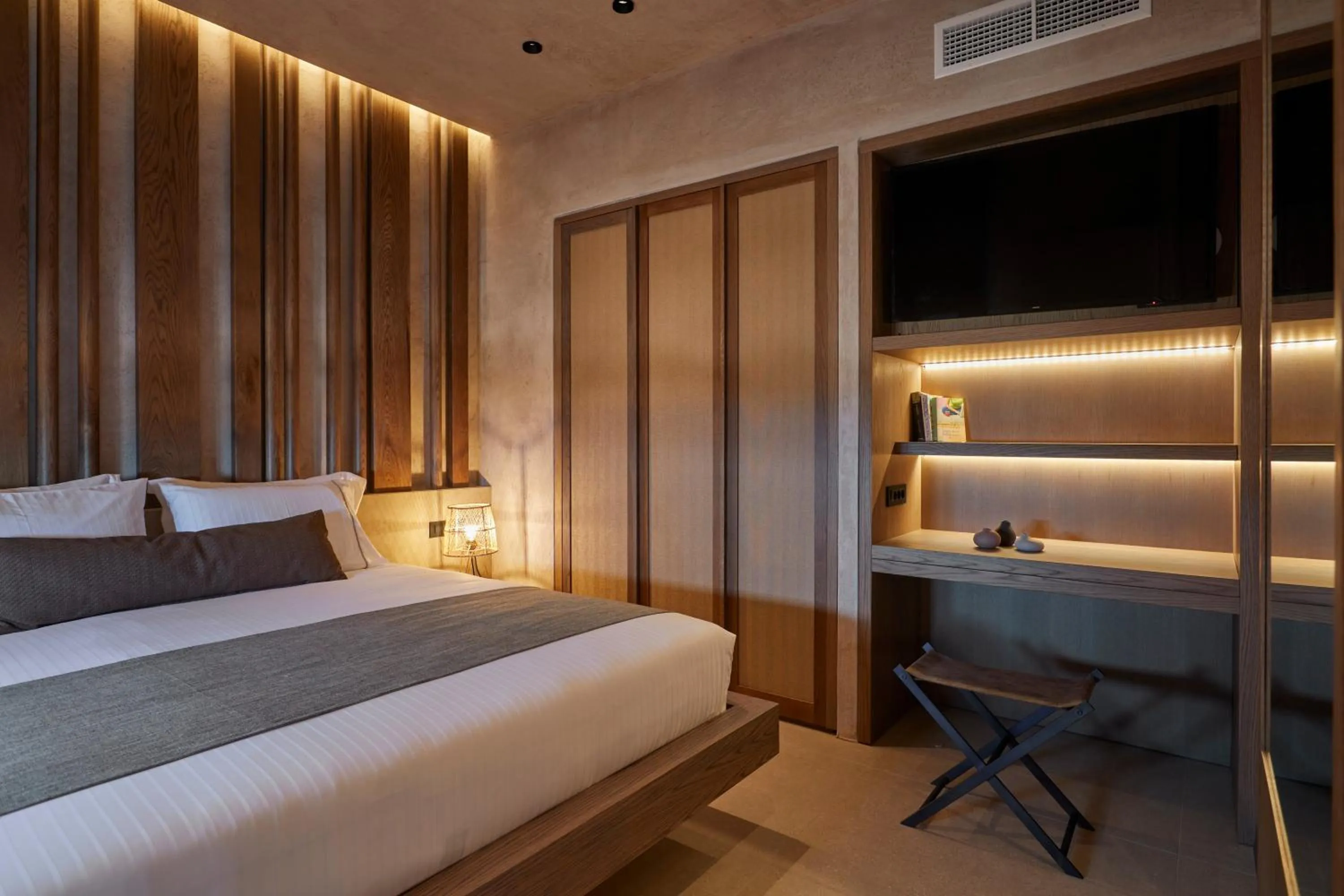 Bed in North Santorini - A Luxury Spa Hotel