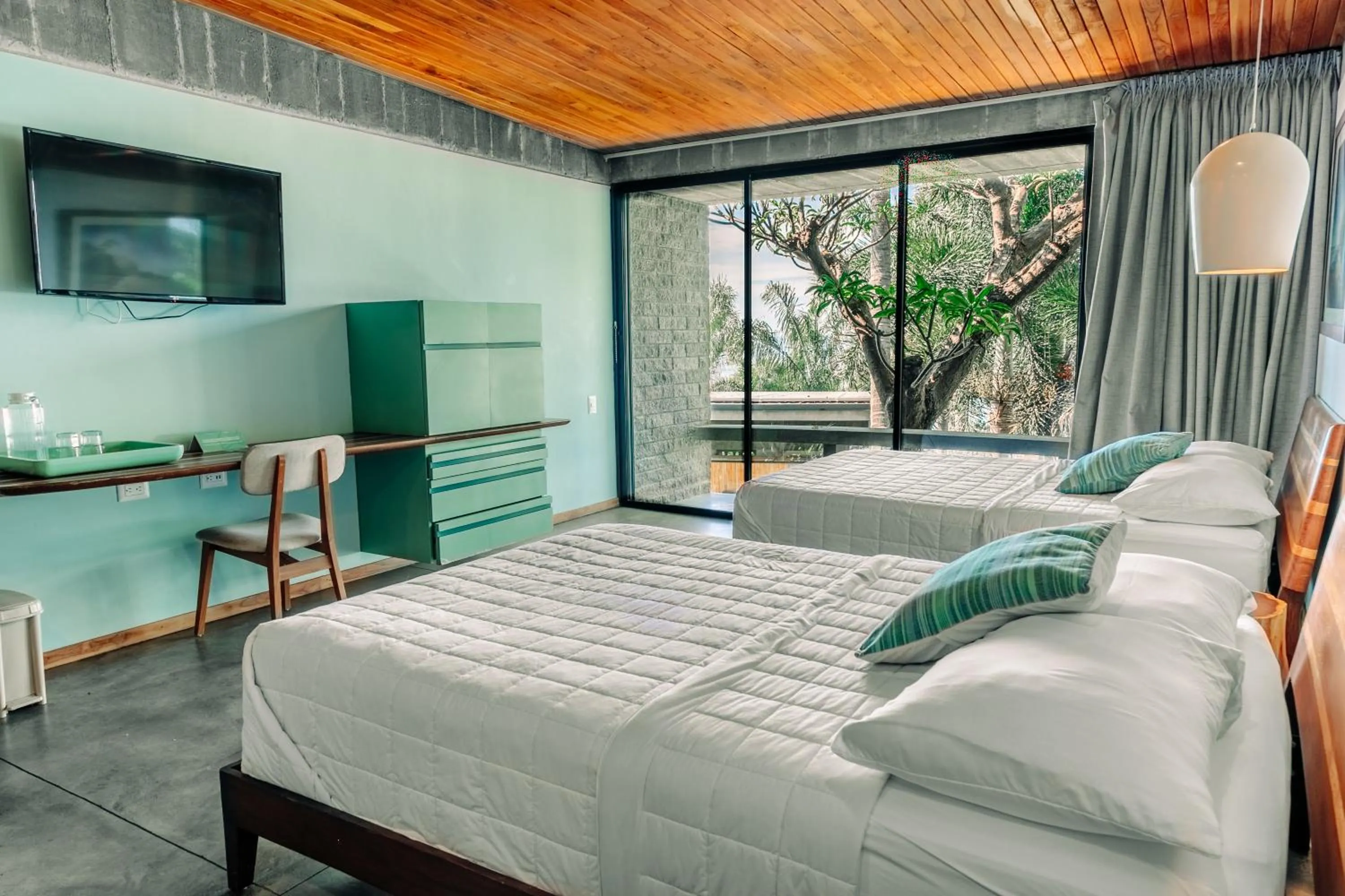 Bed in Puro Surf Hotel & Performance Academy