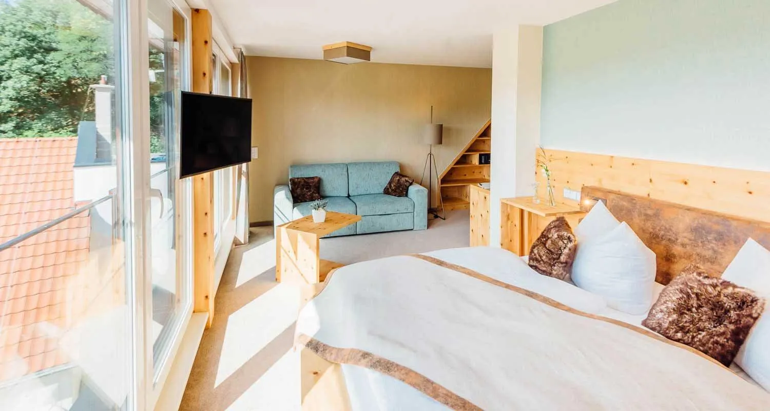 Seating area, Bed in Erlebnishotel "Zur Schiffsmühle" GmbH