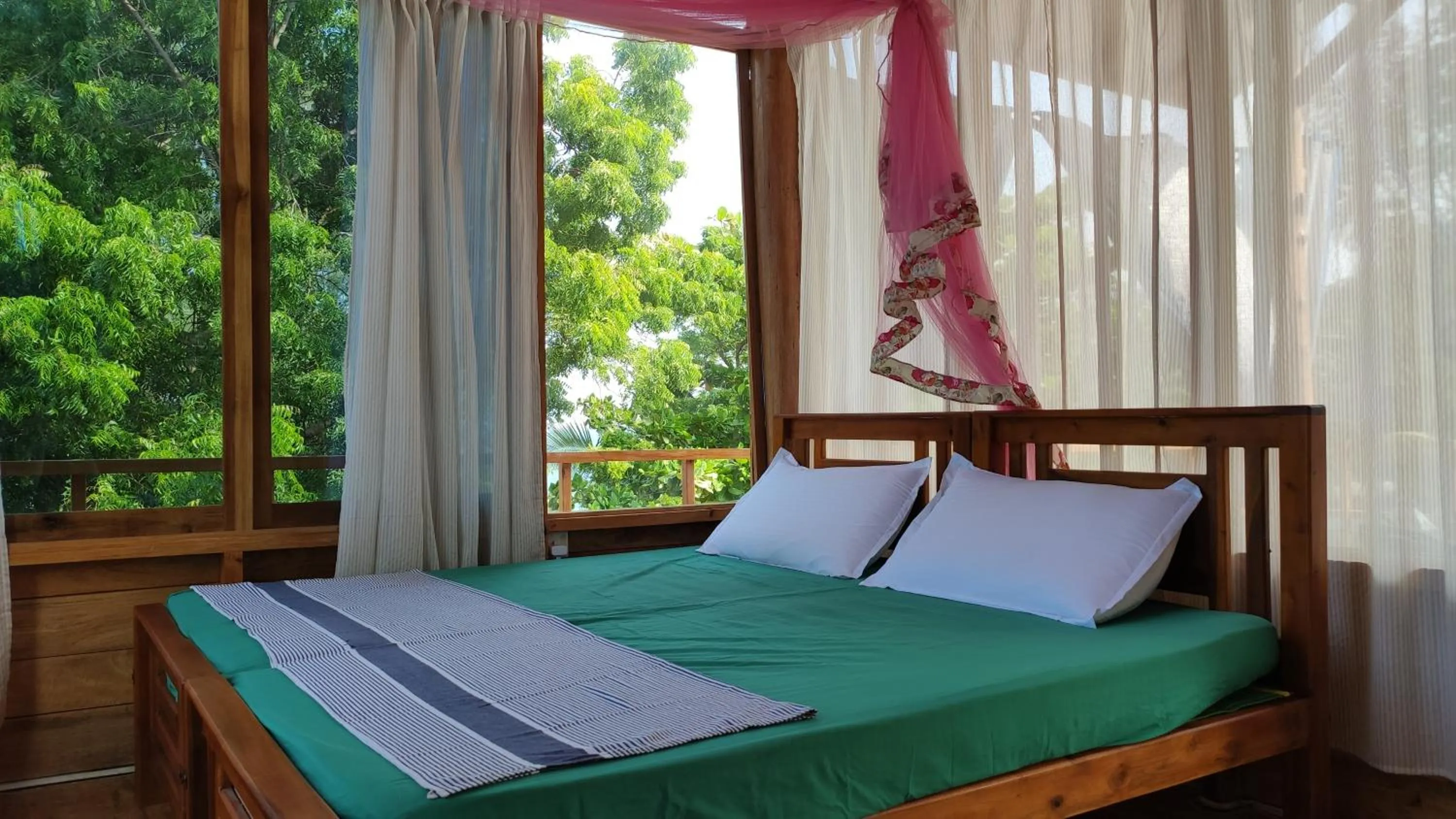 Bed in Surf Beach Hotel