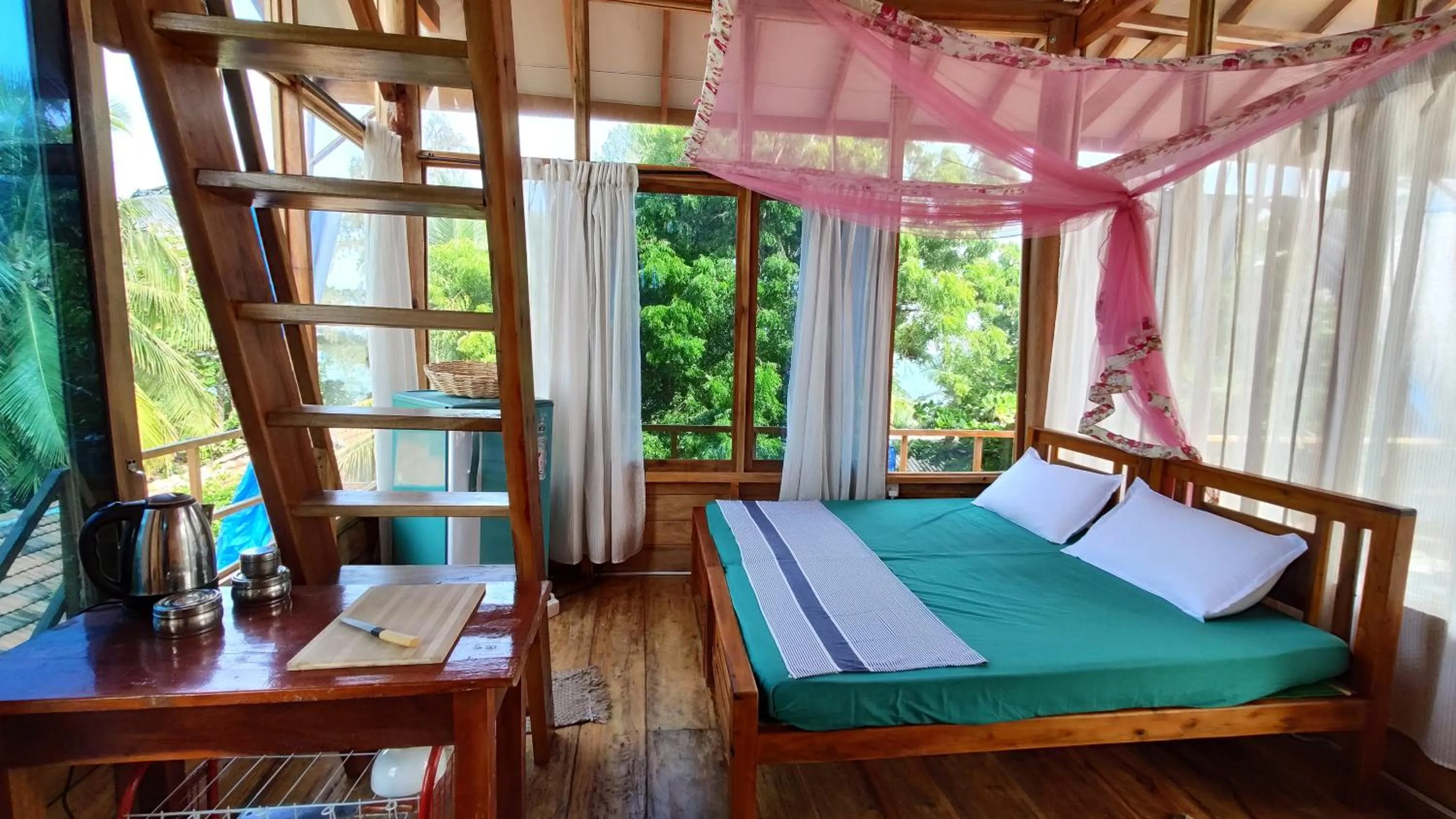 Bed in Surf Beach Hotel