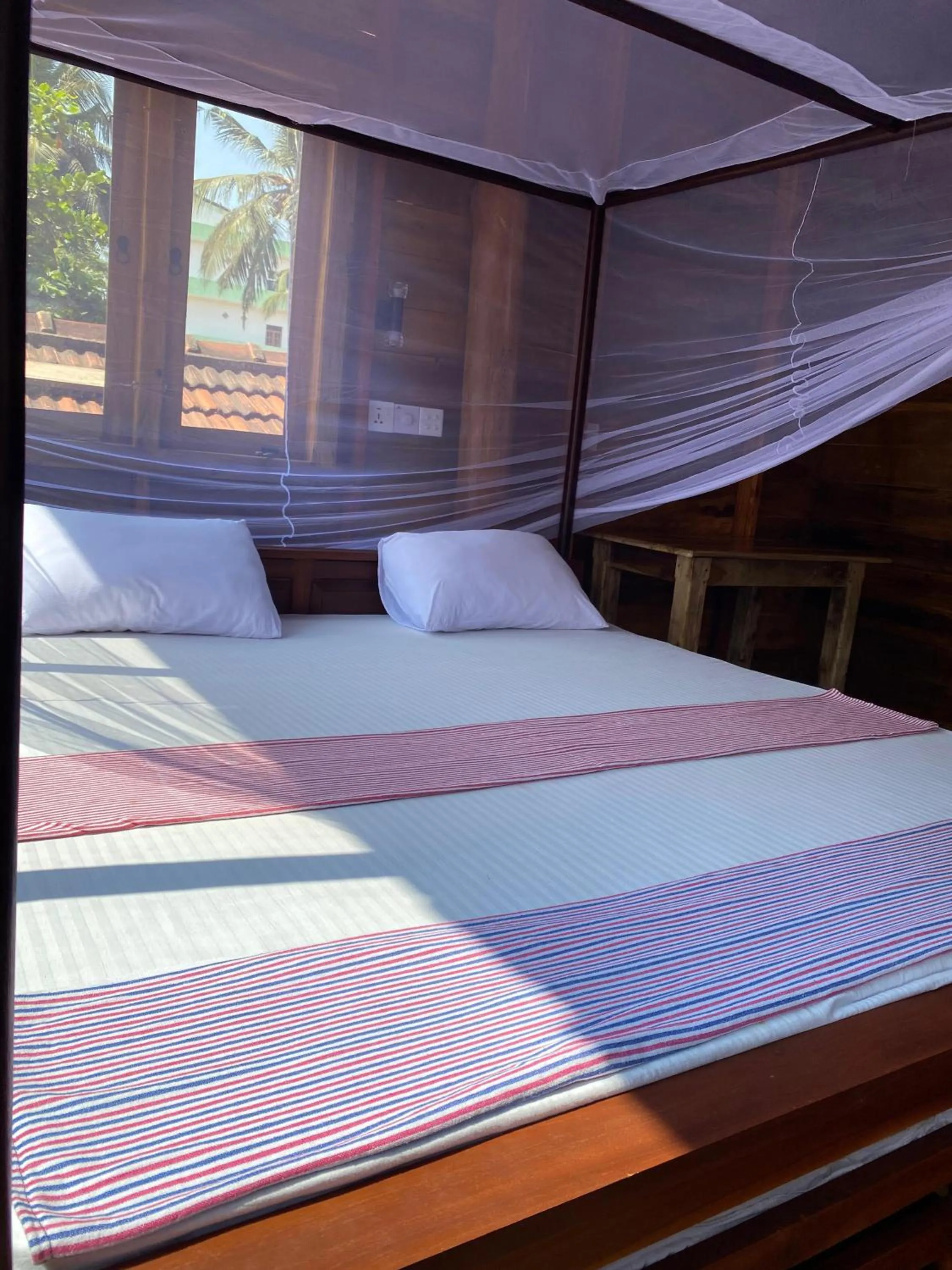 Bed in Surf Beach Hotel