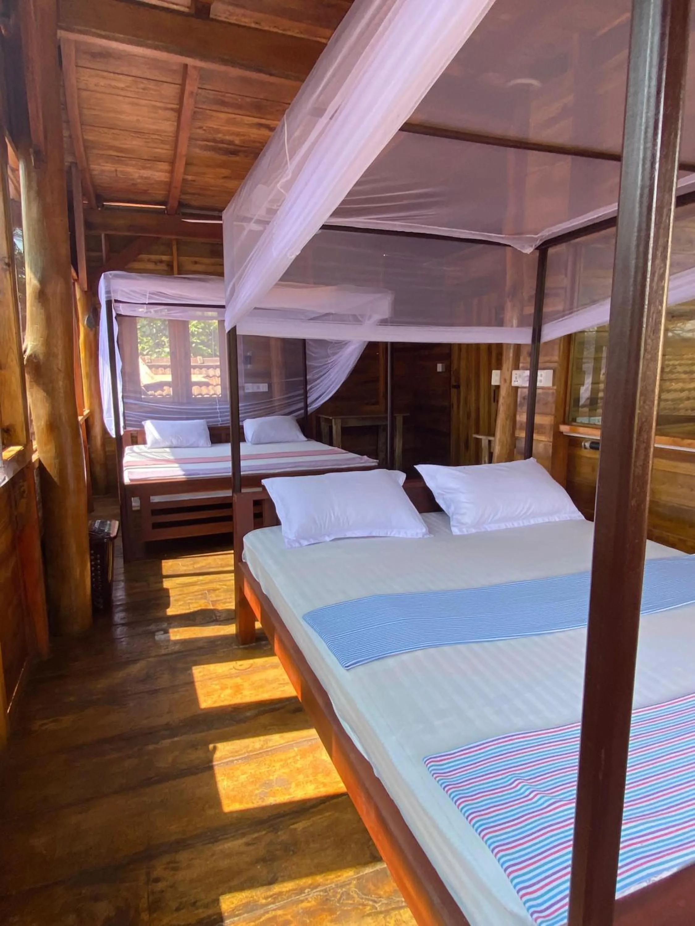 Bed in Surf Beach Hotel