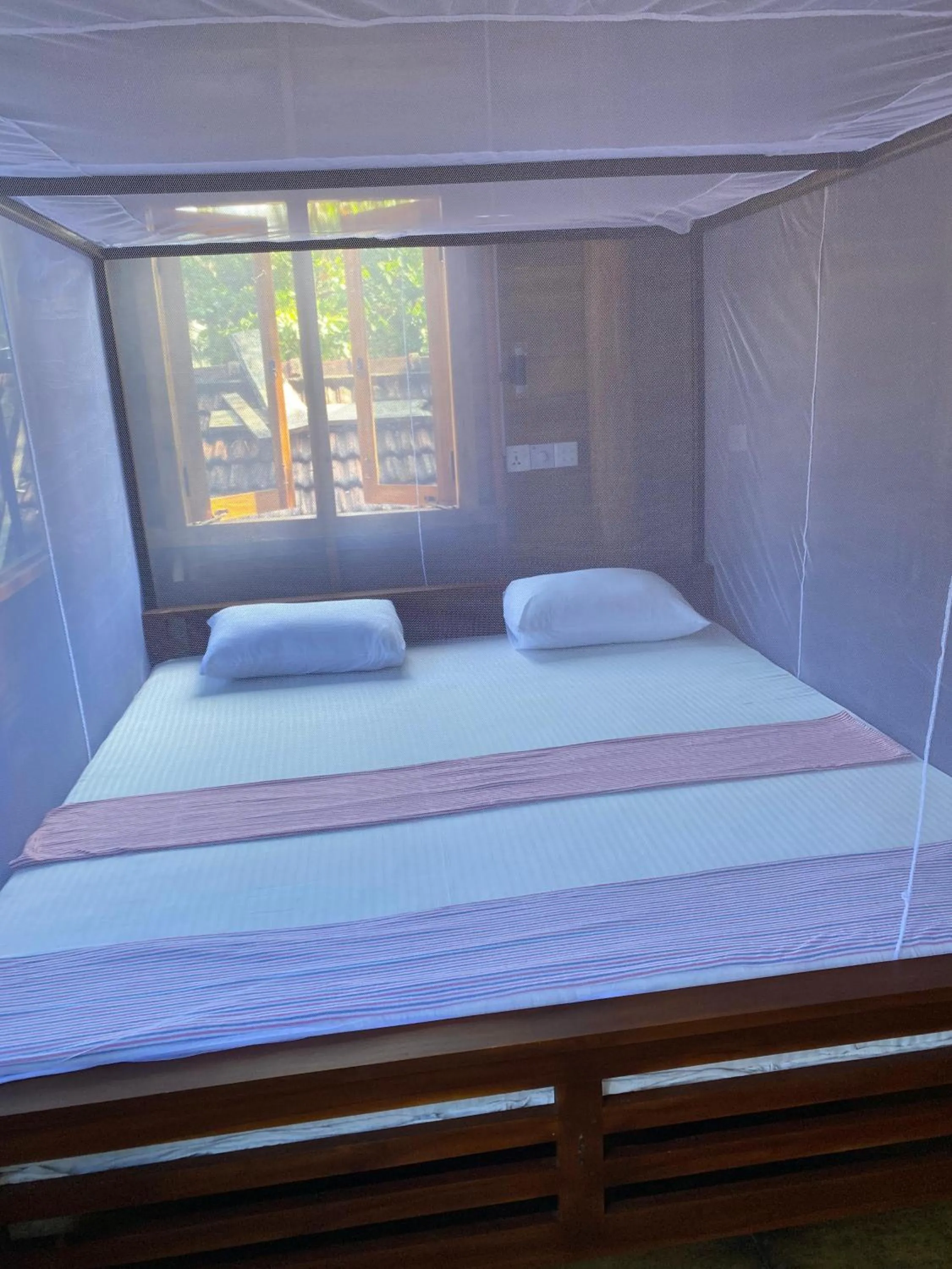Bed in Surf Beach Hotel