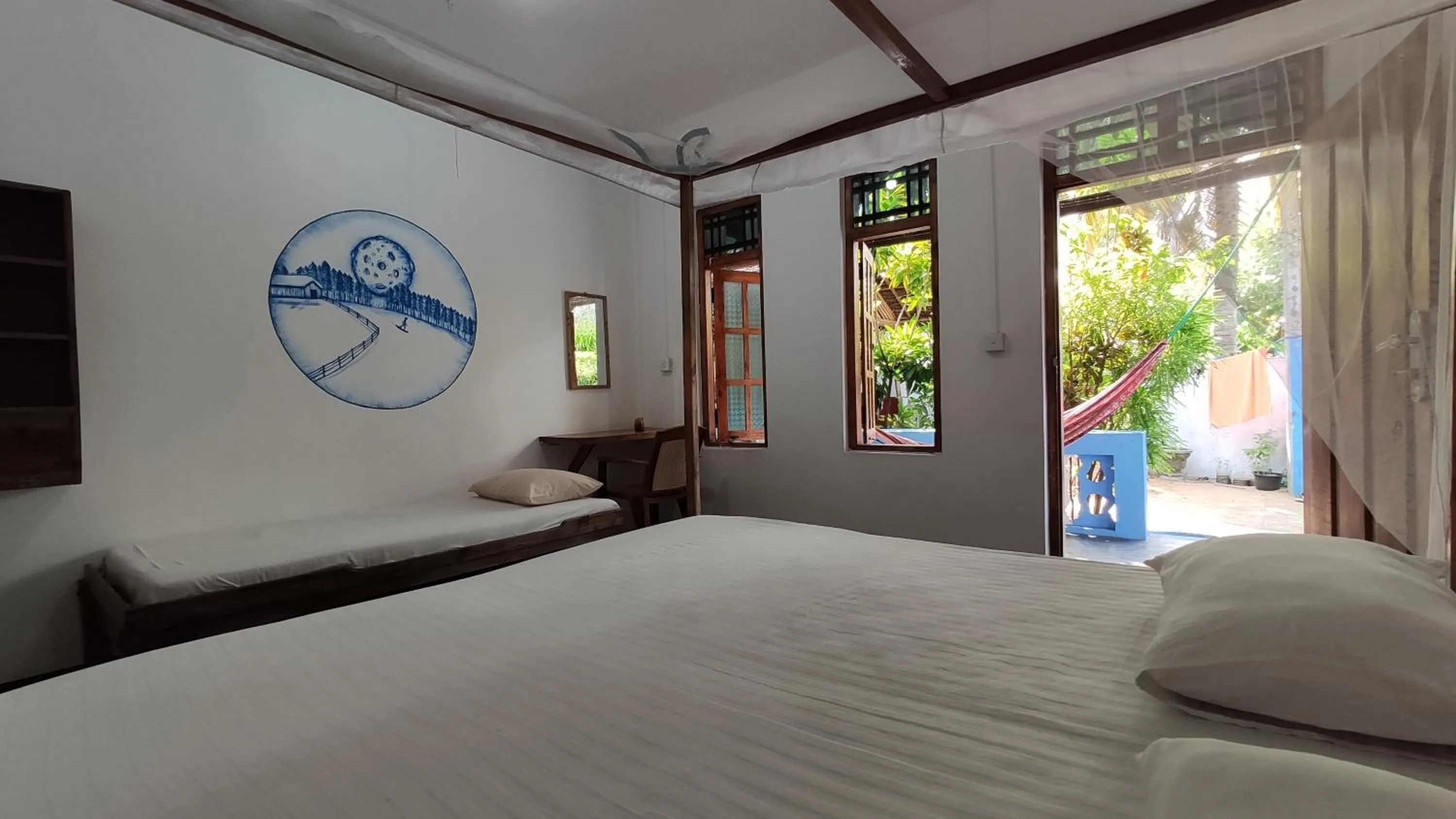 Bed in Surf Beach Hotel