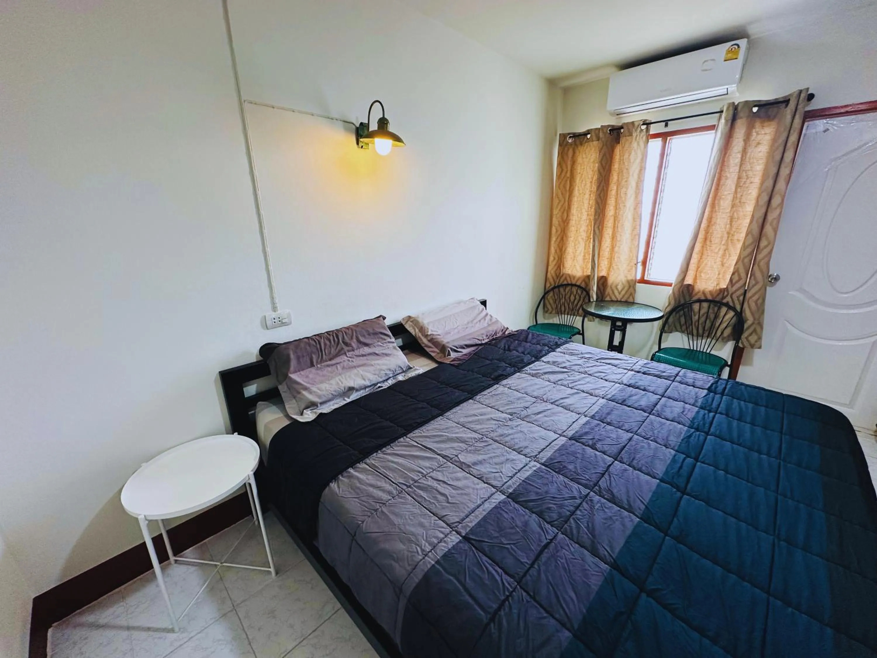 Bed in K.L.Apartment