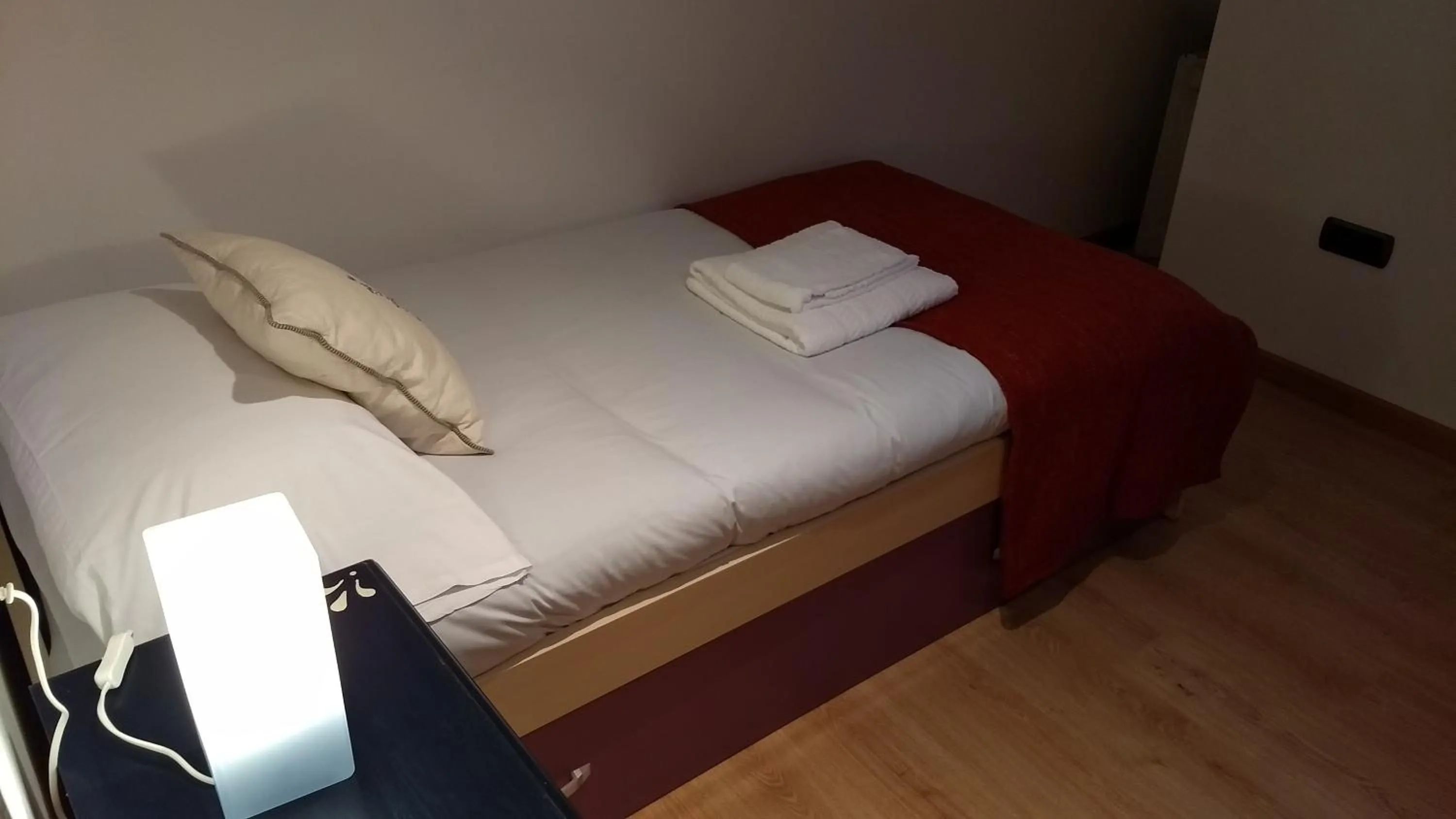 Bed in Apartamentos O Almacen