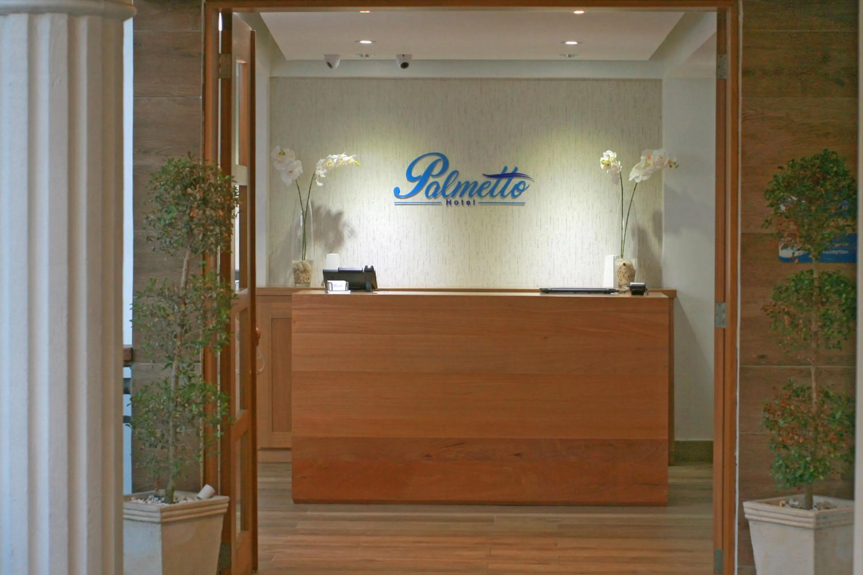 Property logo or sign in Palmetto Hotel