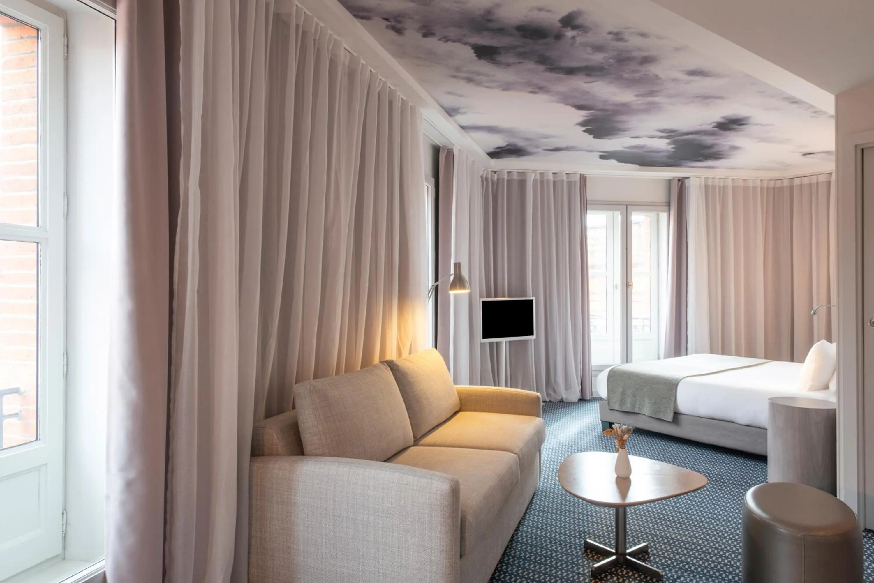 Bedroom in Le Grand Balcon Hotel