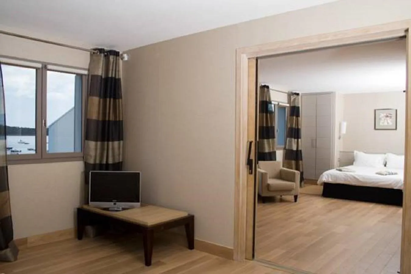 Seating area, Bed in Le Pinarello