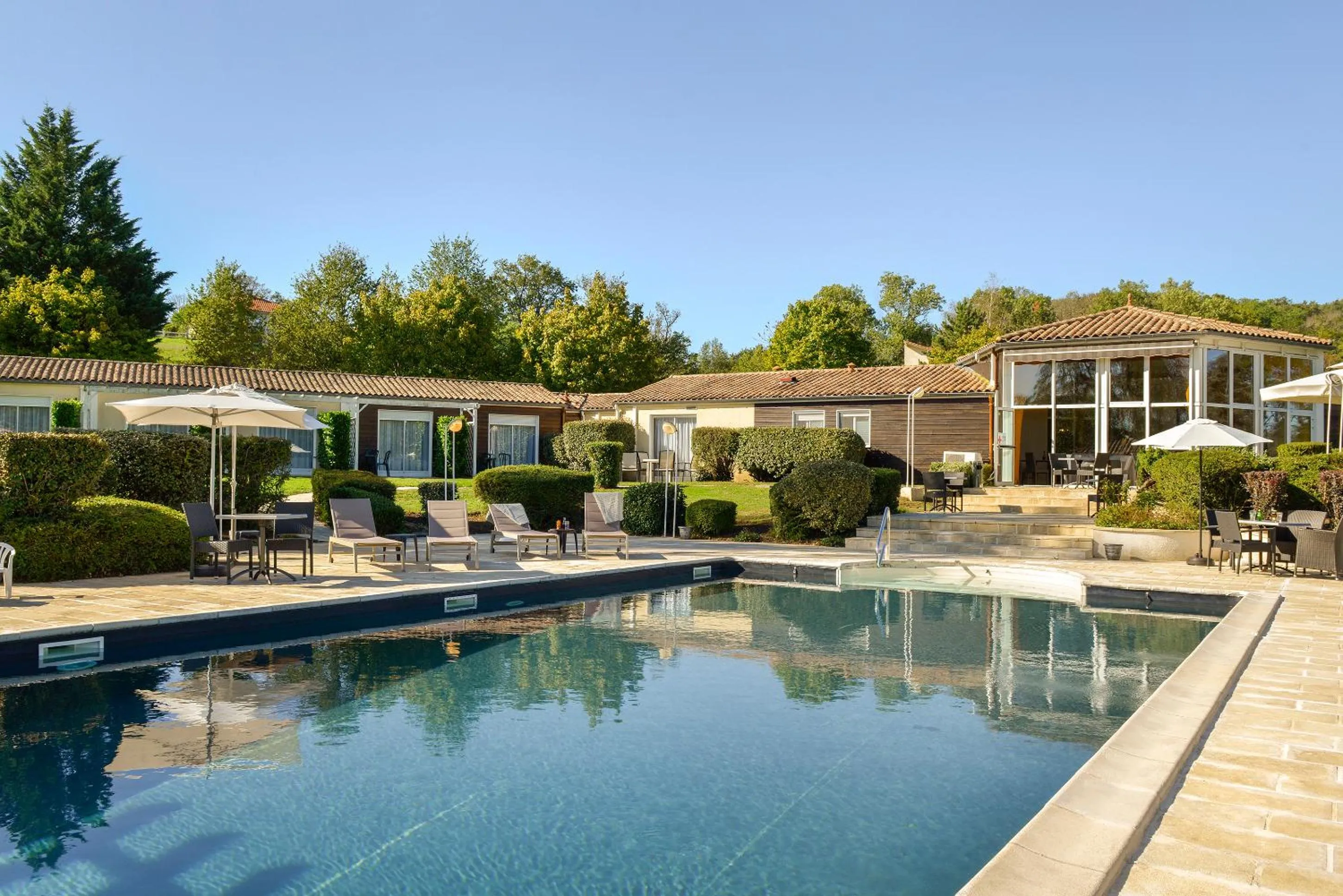 Swimming pool in Logis Hôtel Val de Vienne