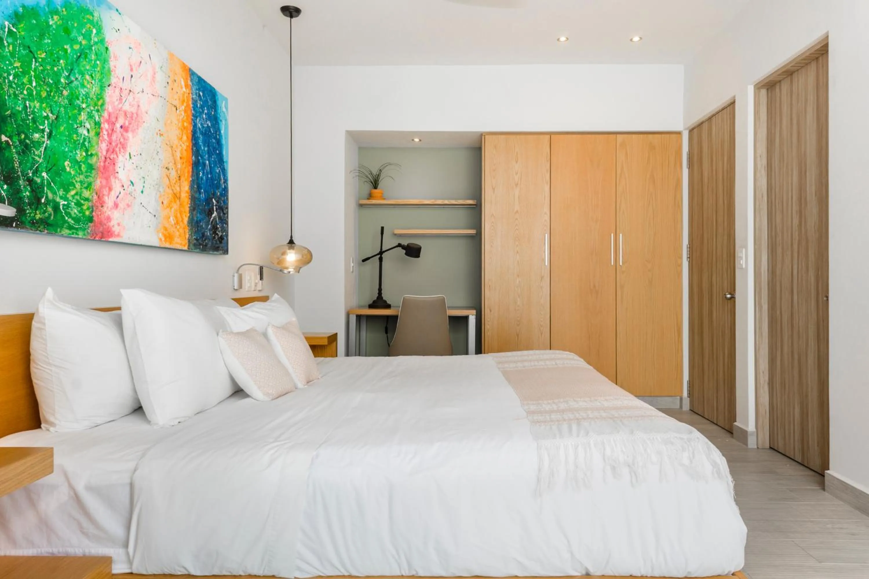 Bed in Opal Suites Apartments