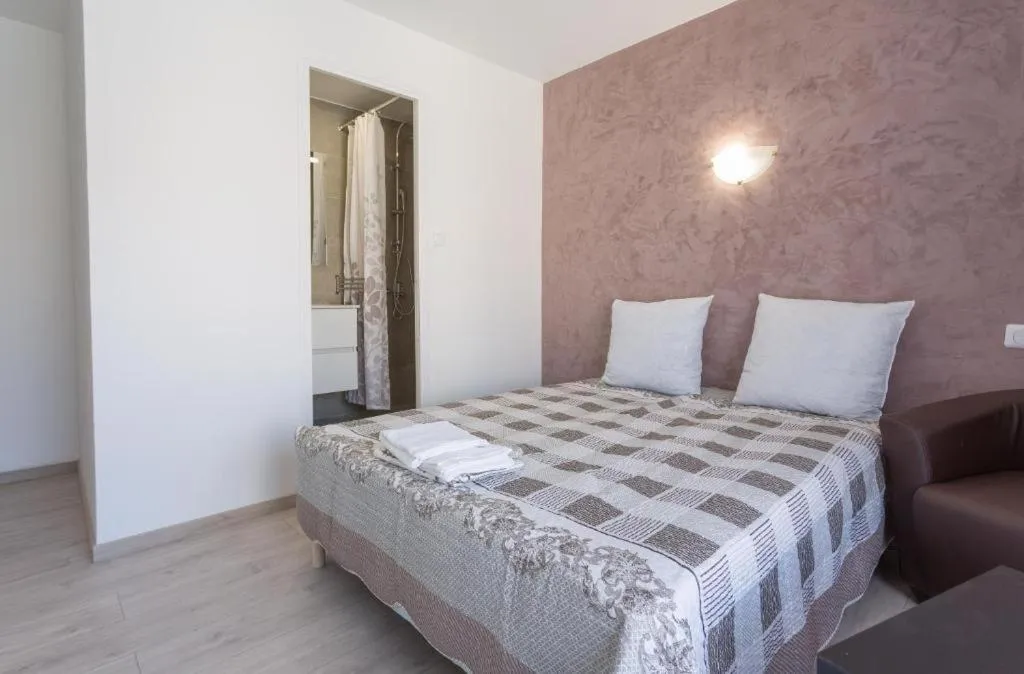 Bed in Hotel Alizéa