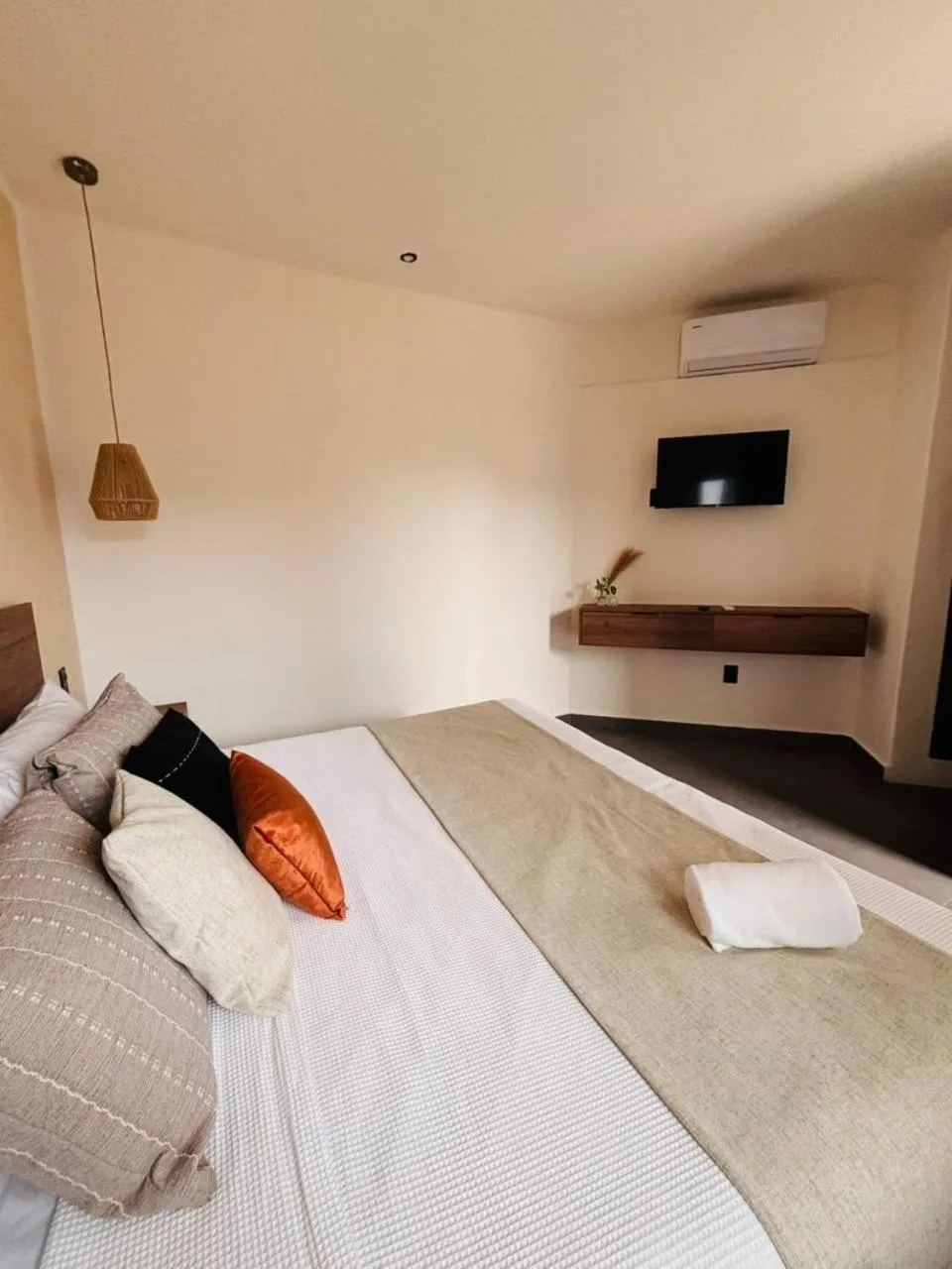 Bed in Aruma Suites
