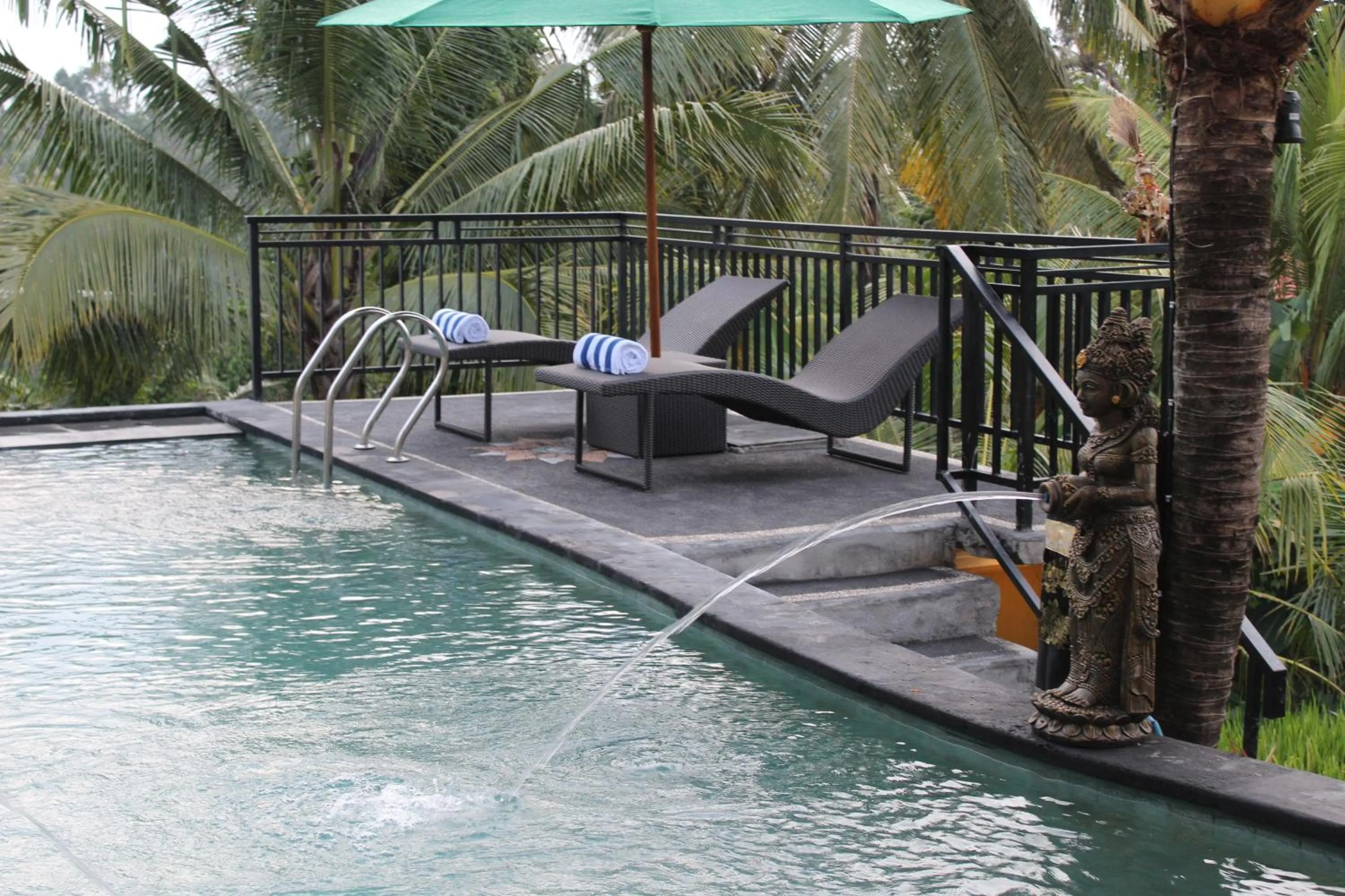 Pool view in Adi Bisma Inn by Mahaputra