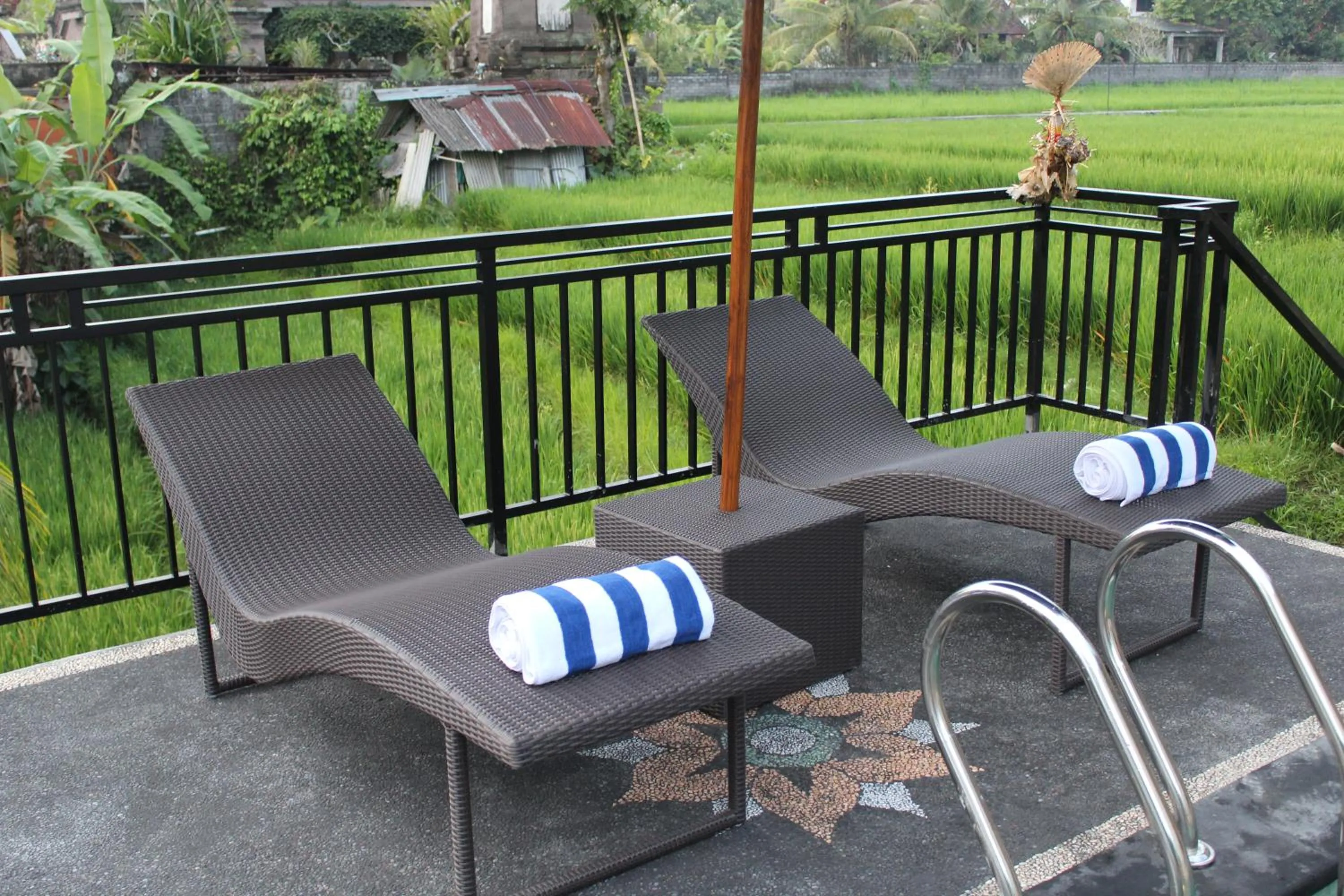 Communal lounge/ TV room in Adi Bisma Inn by Mahaputra