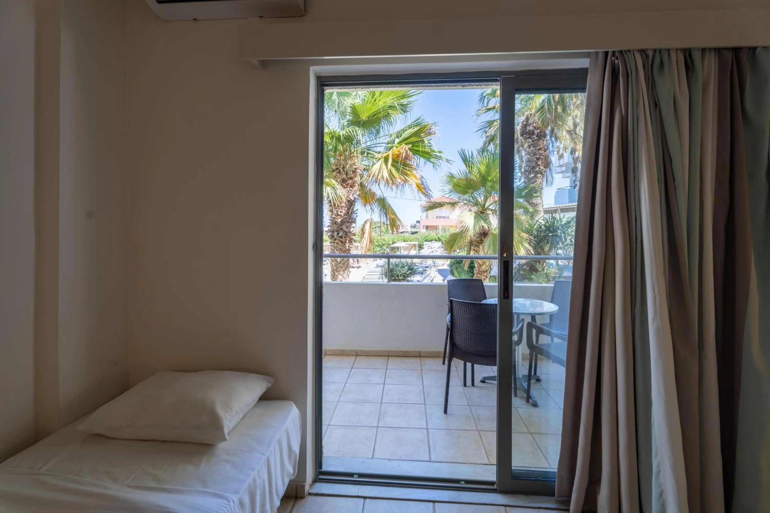 Balcony/Terrace, Bed in Gouves Bay by Omilos Hotels