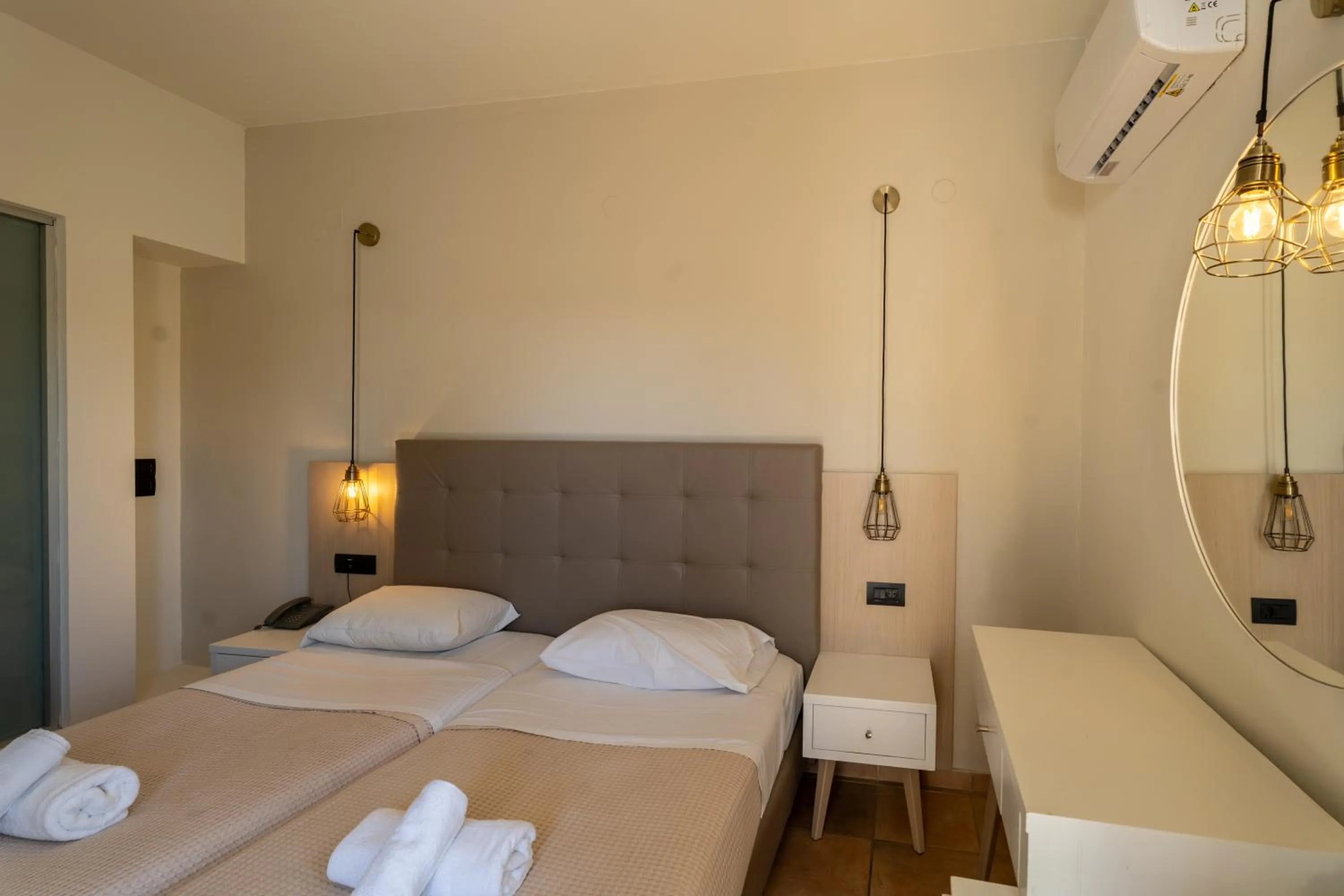 Bedroom, Bed in Gouves Bay by Omilos Hotels