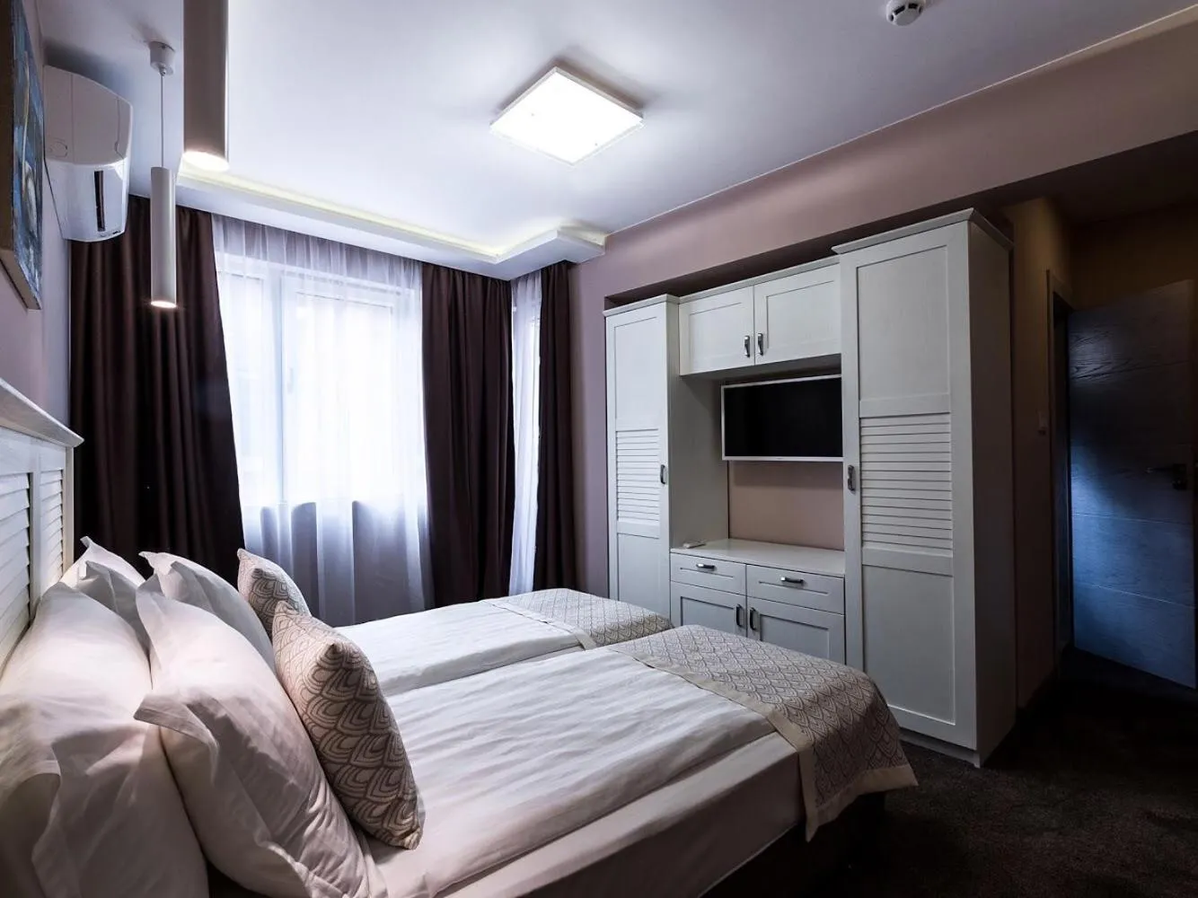 Bed in Caro Apartments & Rooms