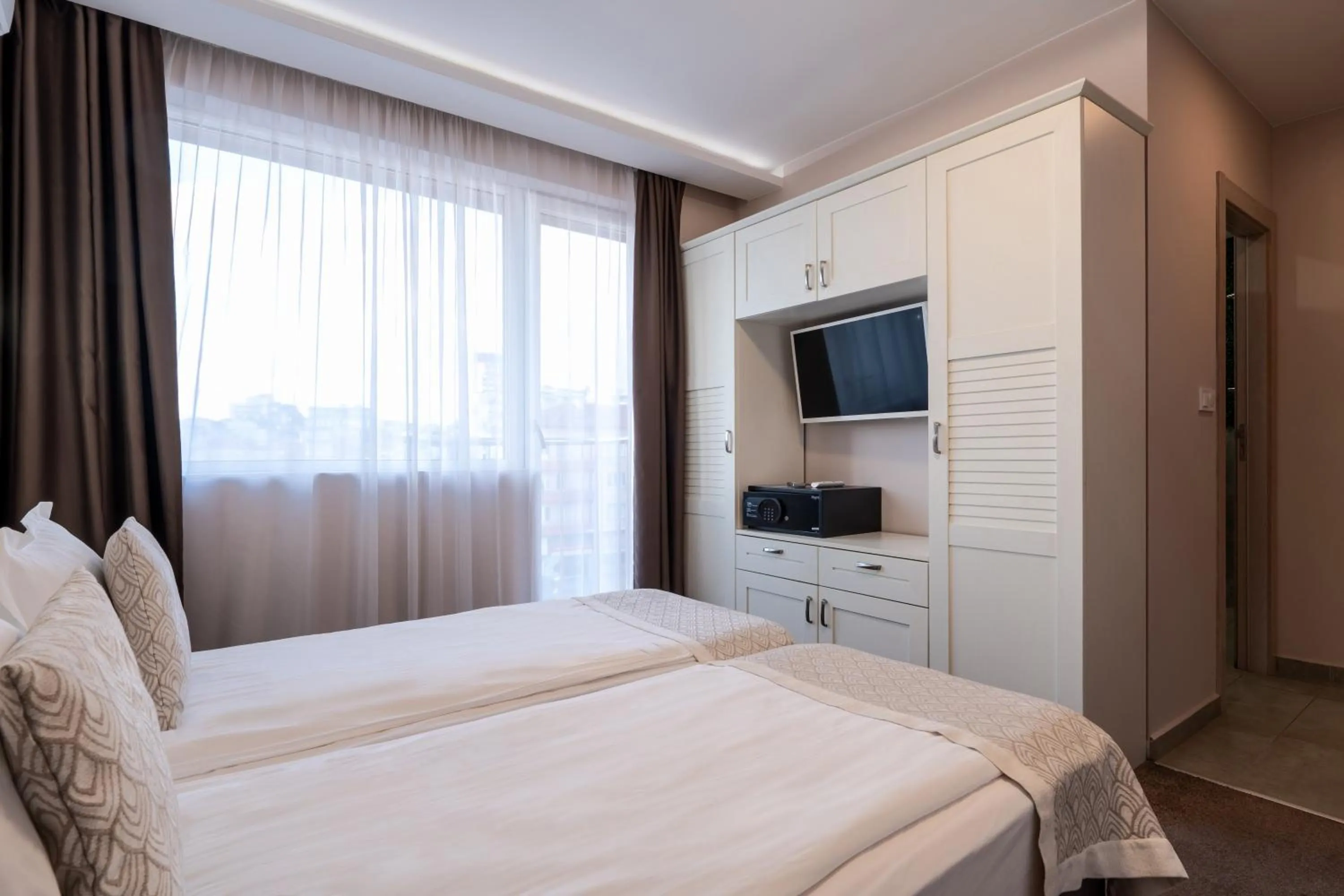 Bed in Caro Apartments & Rooms