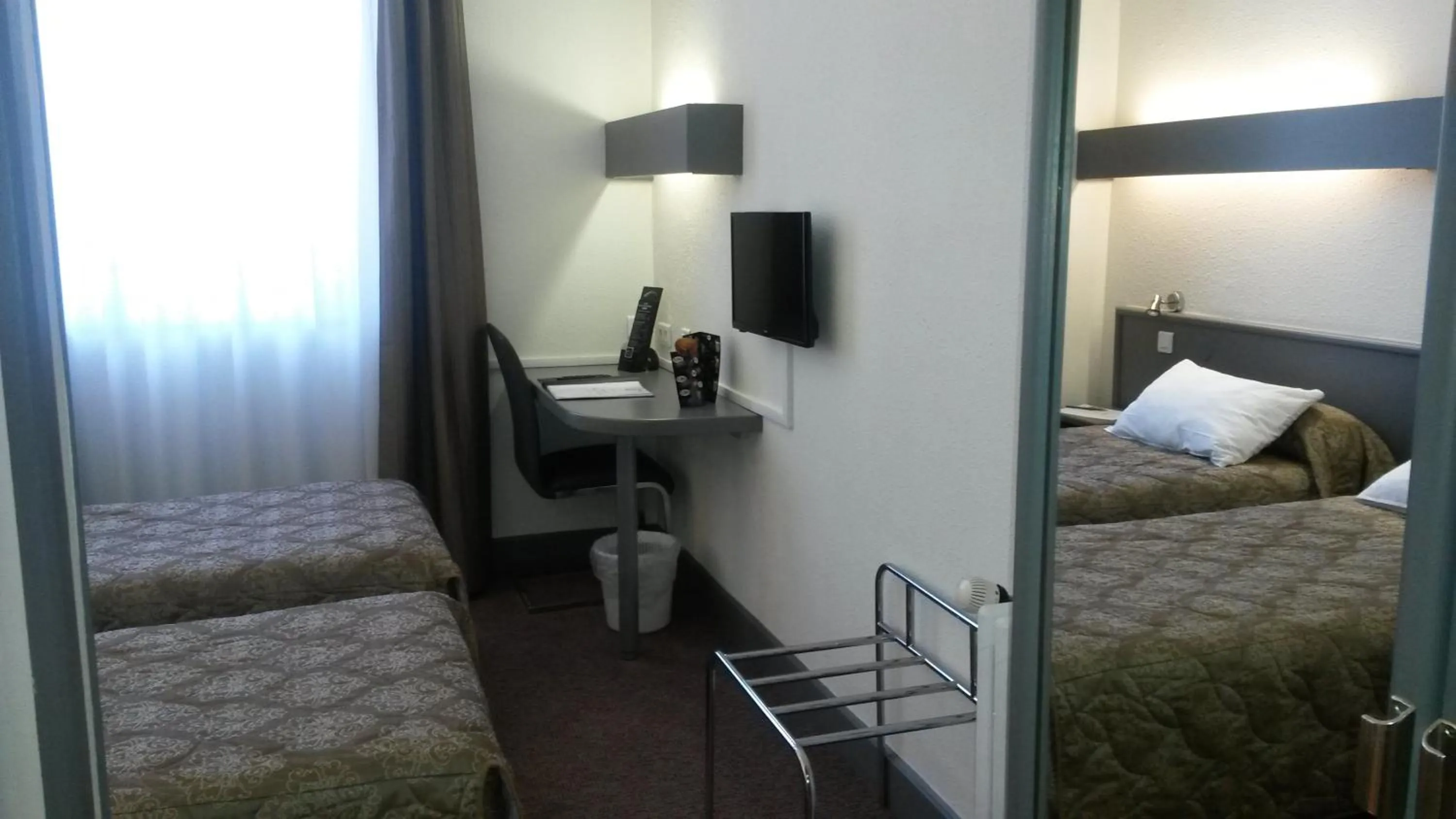 Photo of the whole room, Bed in Hôtel de La Cloche