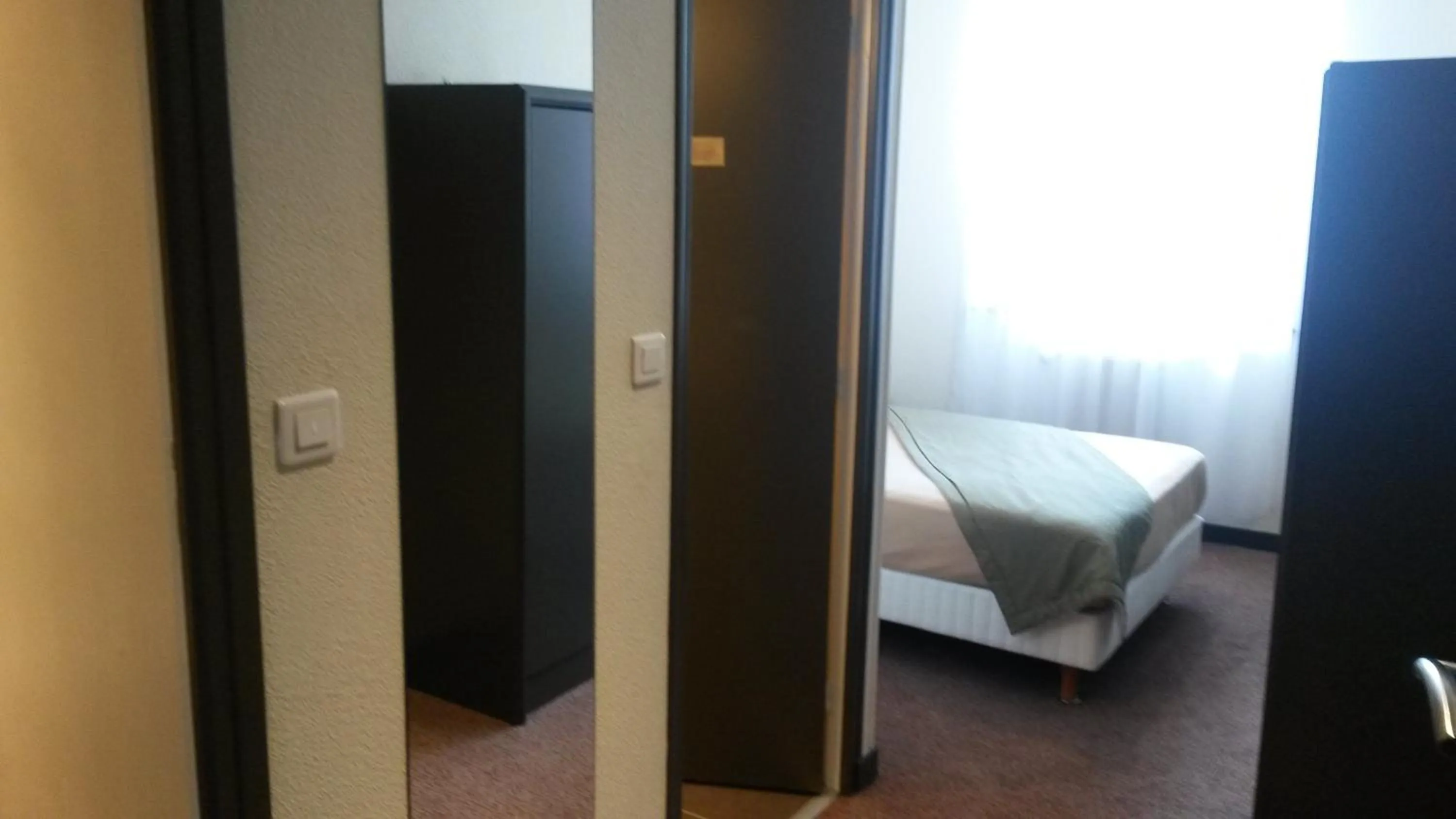 Photo of the whole room, Bed in Hôtel de La Cloche