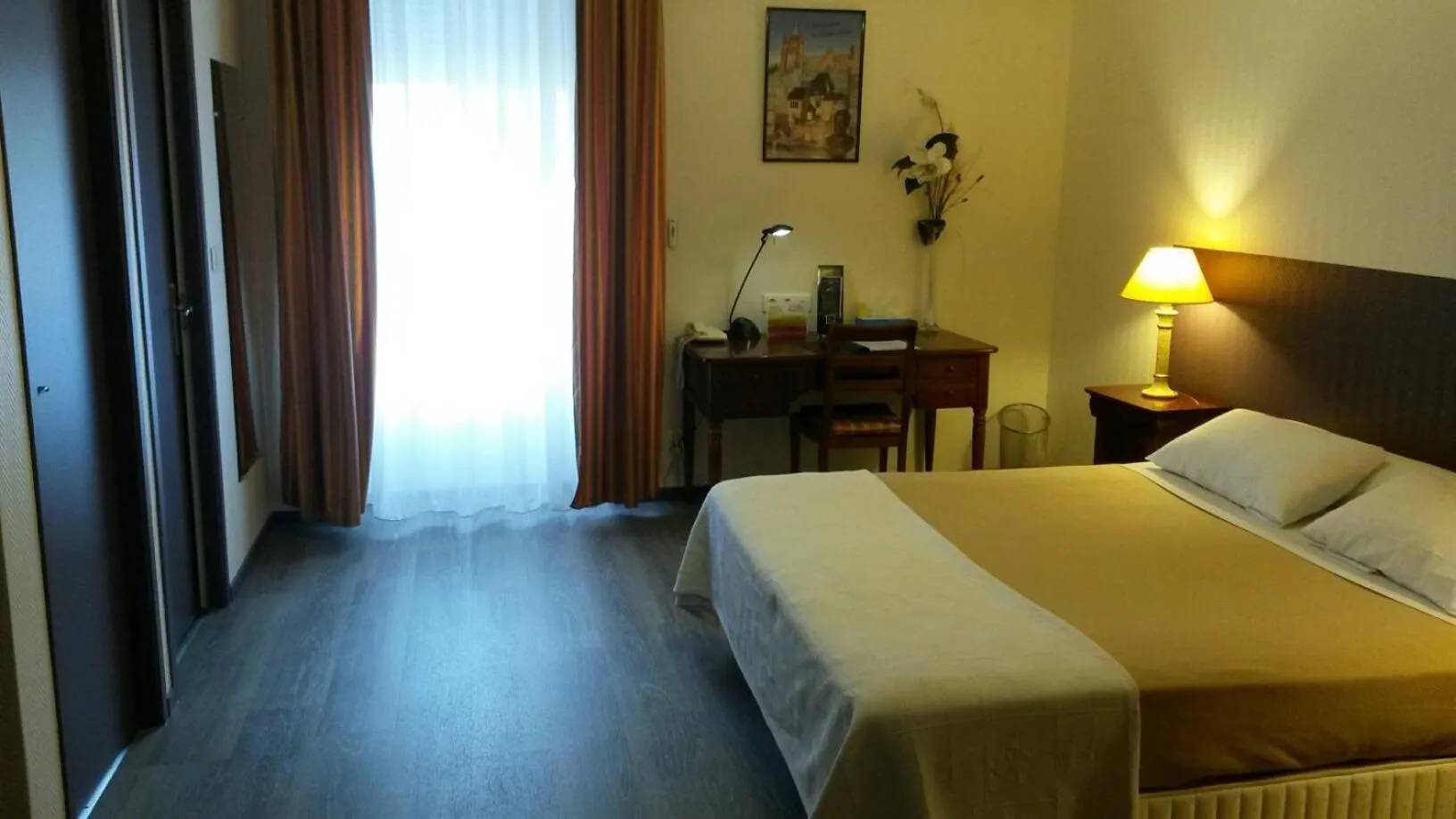 Photo of the whole room, Bed in Hôtel de La Cloche