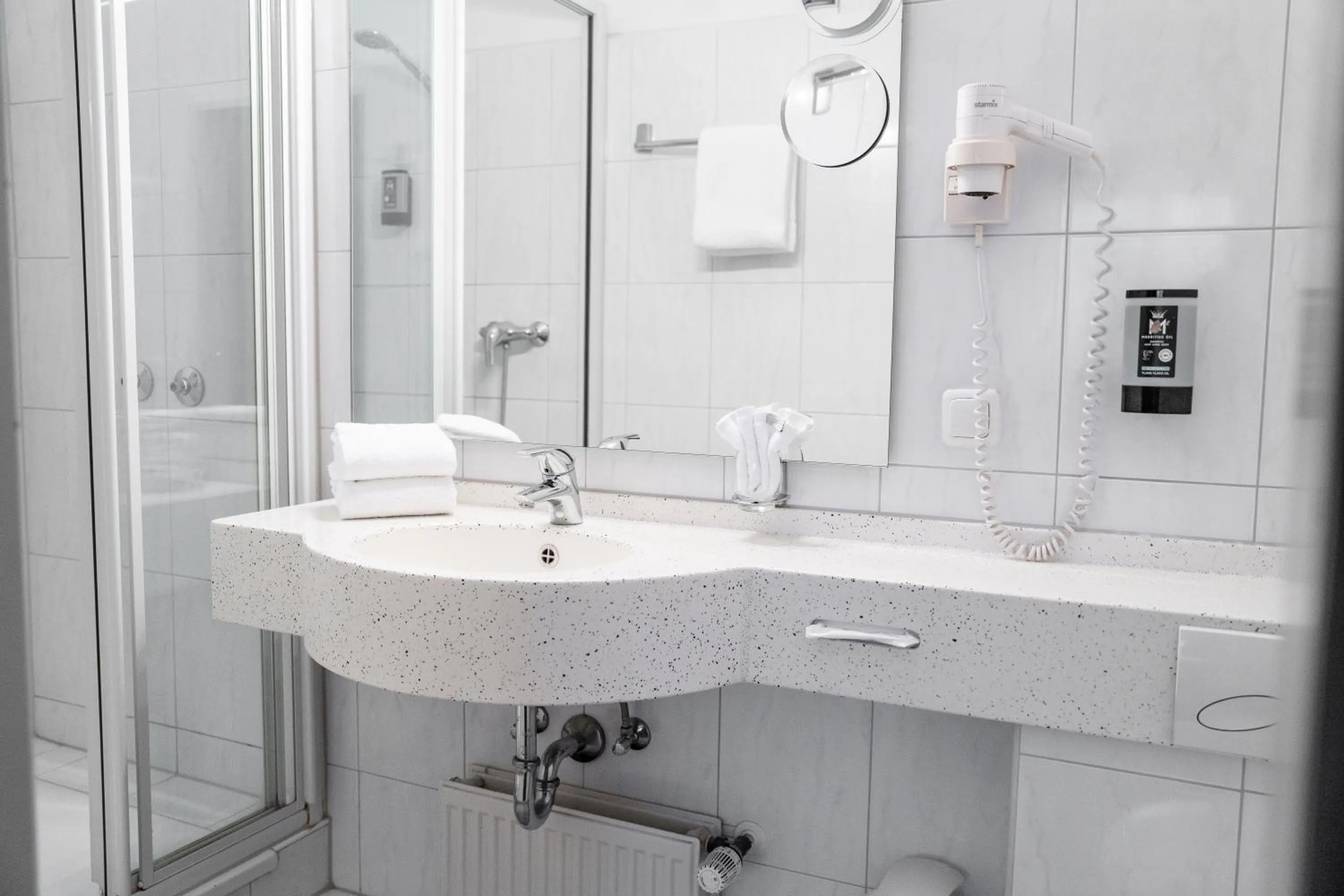 Bathroom in Astor & Aparthotel