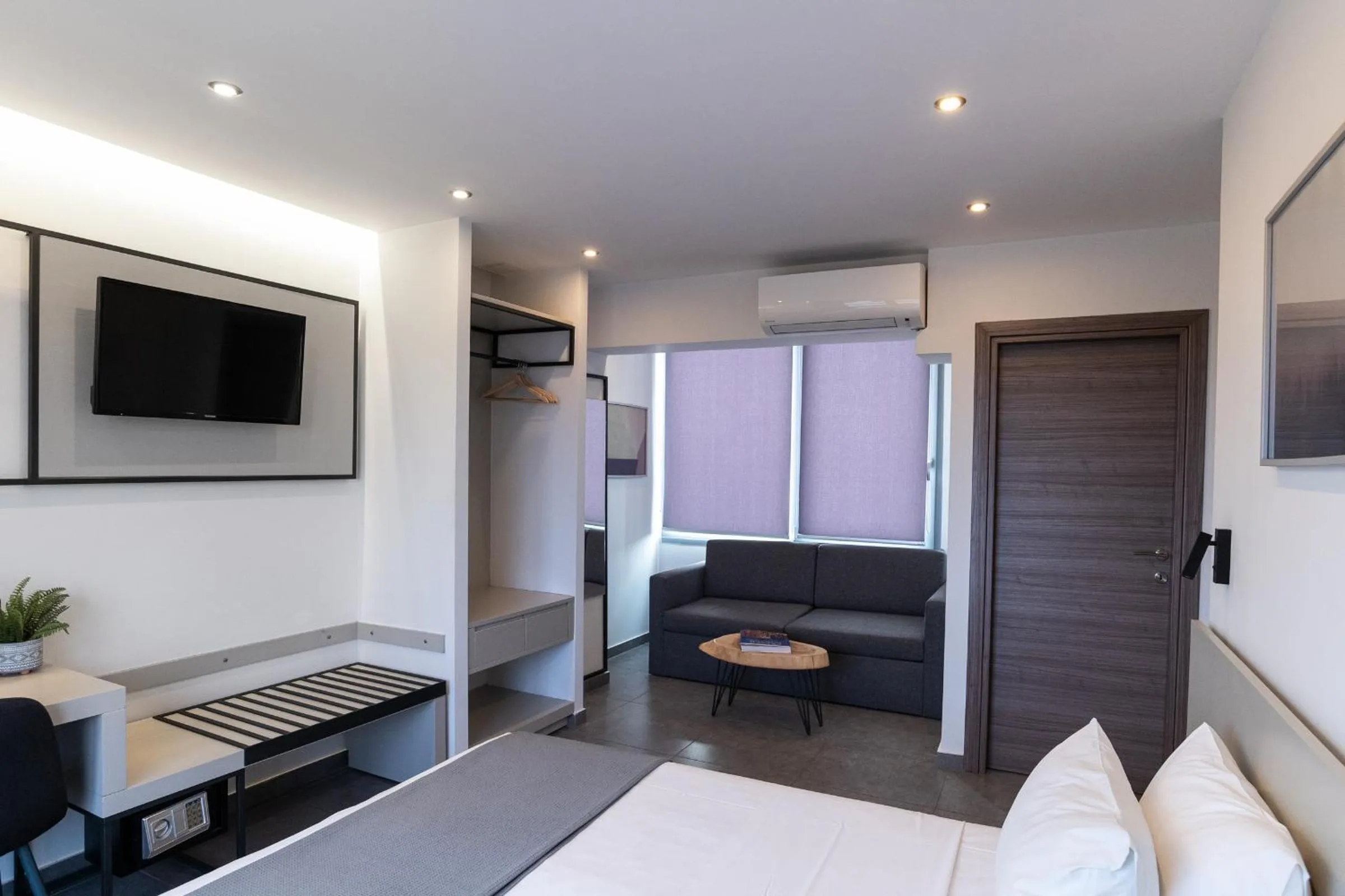 Photo of the whole room, Bed in White Luxury