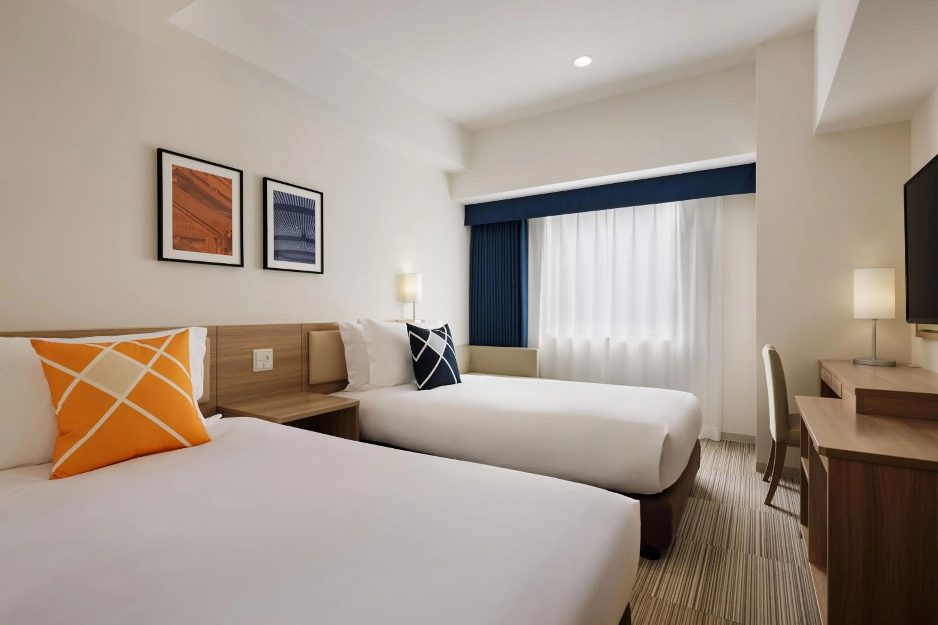 Bed in UNIZO INN Kanazawa Hyakumangoku Dori