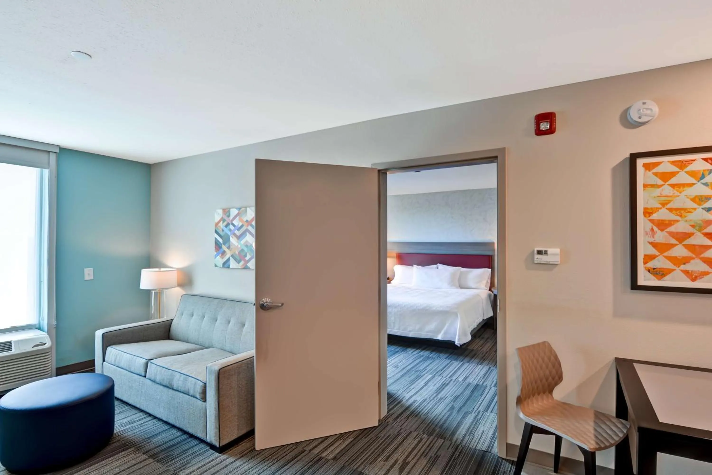 Living room, Bed in Home2 Suites By Hilton Tampa USF Near Busch Gardens