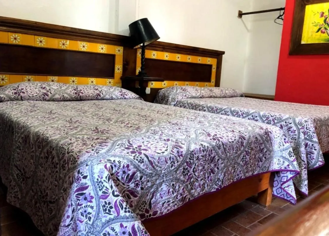 Bed in Hotel Posada San Agustin