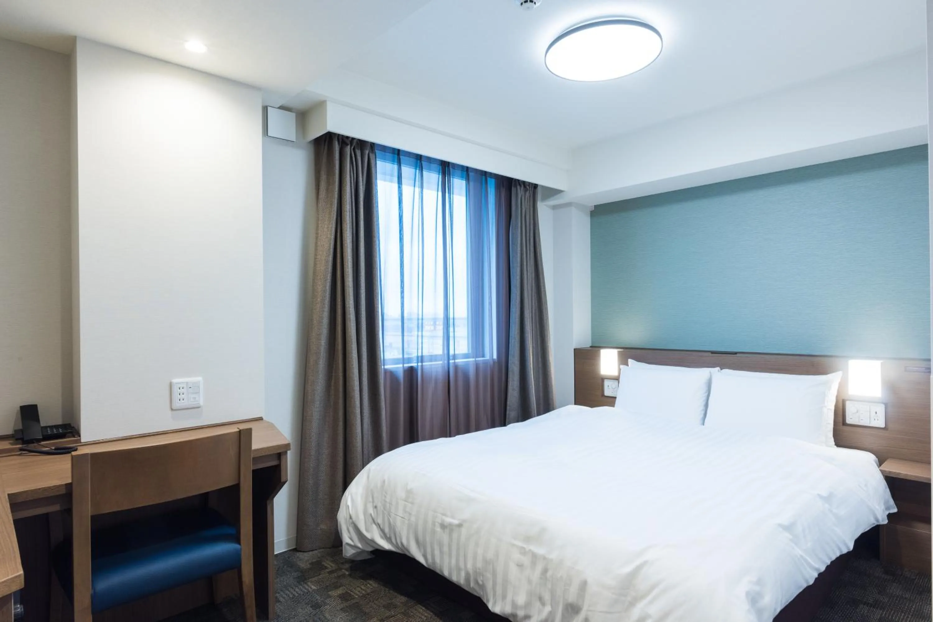 Bed in Dormy Inn EXPRESS Sendai Seaside