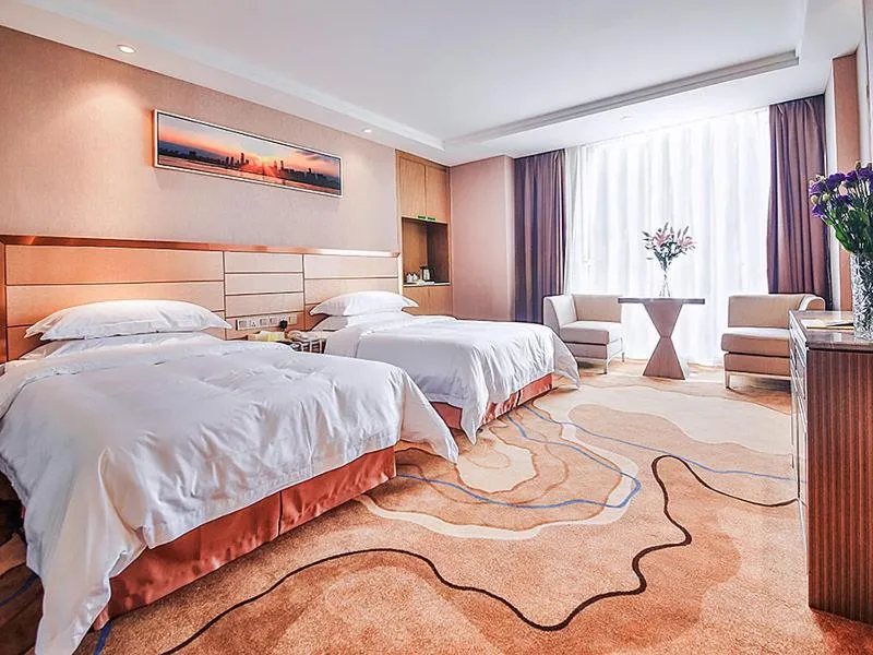 Bed in Vienna International Hotel Huhan Jiedaokou