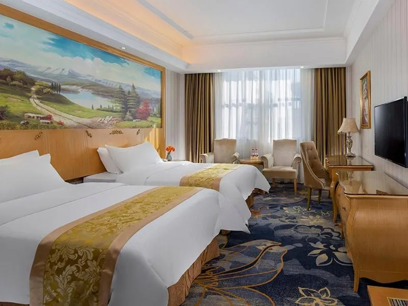 Bed in Vienna Hotel Meizhou Jiangnan