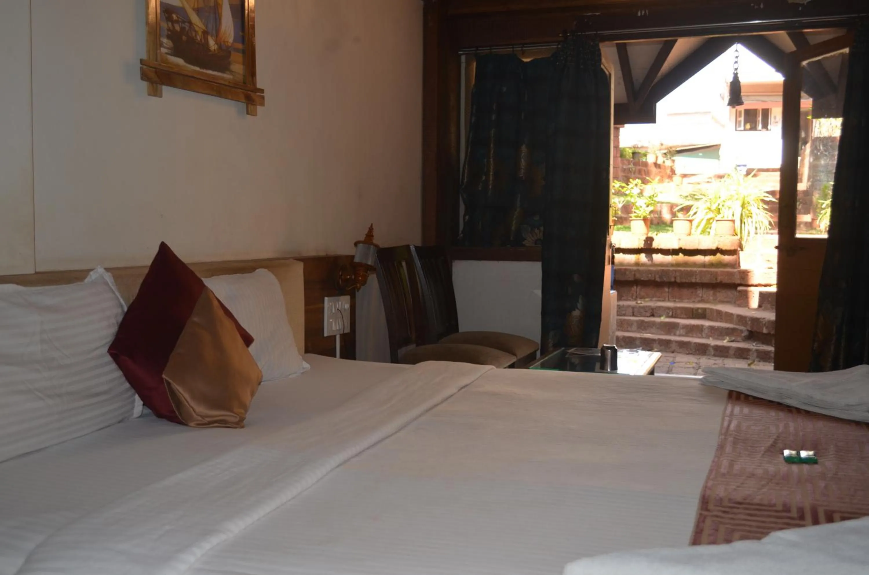 Bed in Kaular Atithis Grand Kokan Resort