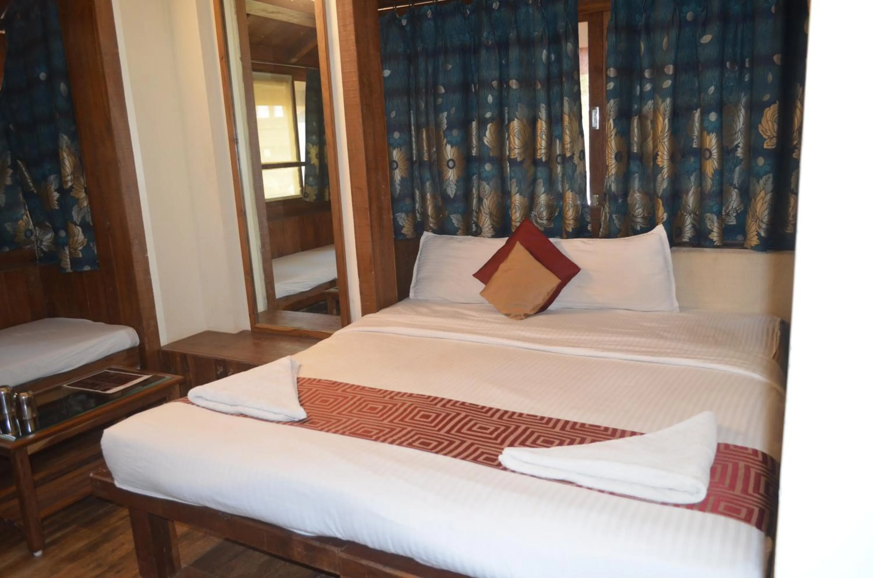 Bed in Kaular Atithis Grand Kokan Resort