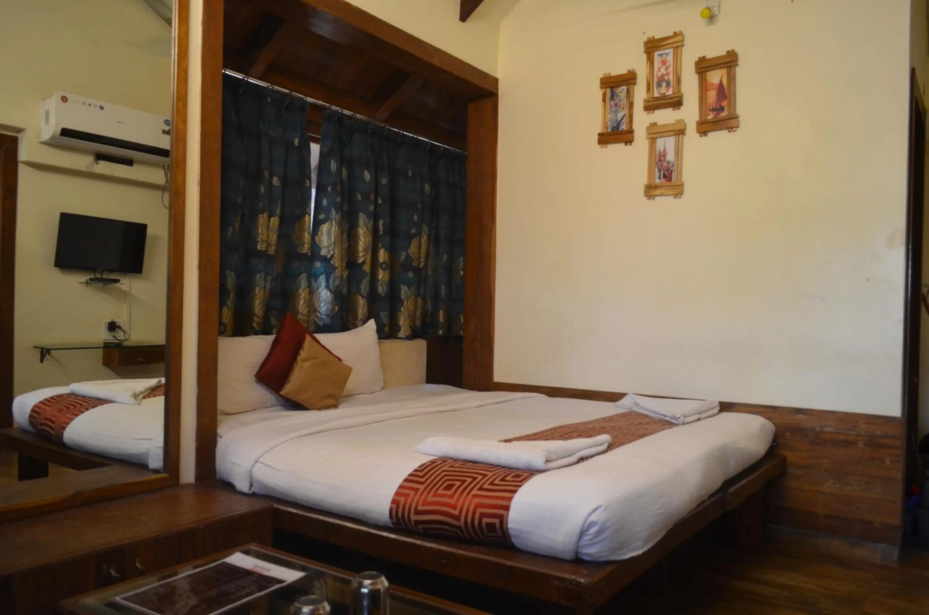 Bed in Kaular Atithis Grand Kokan Resort