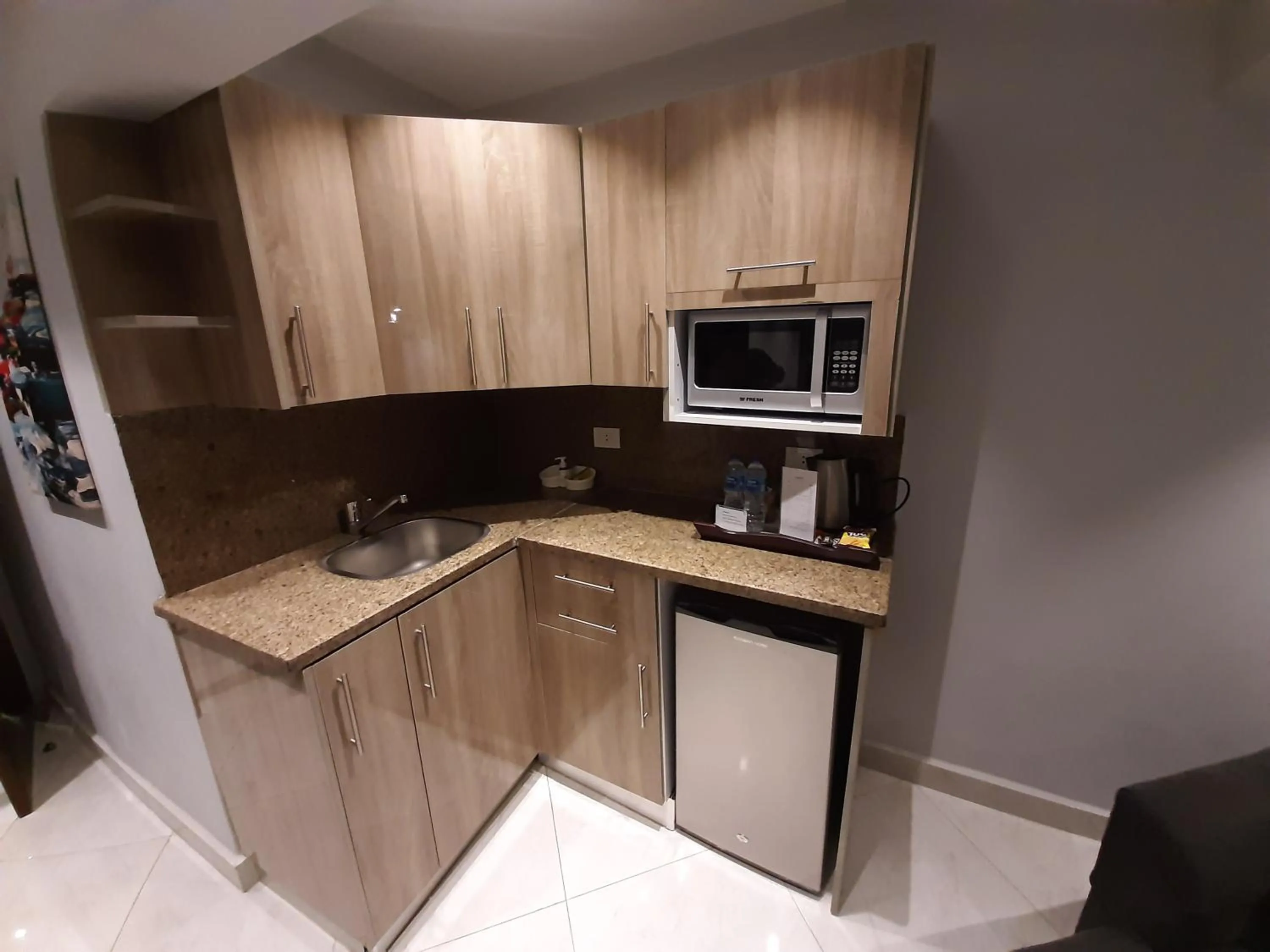 Kitchen or kitchenette in Nakhil Inn Residence